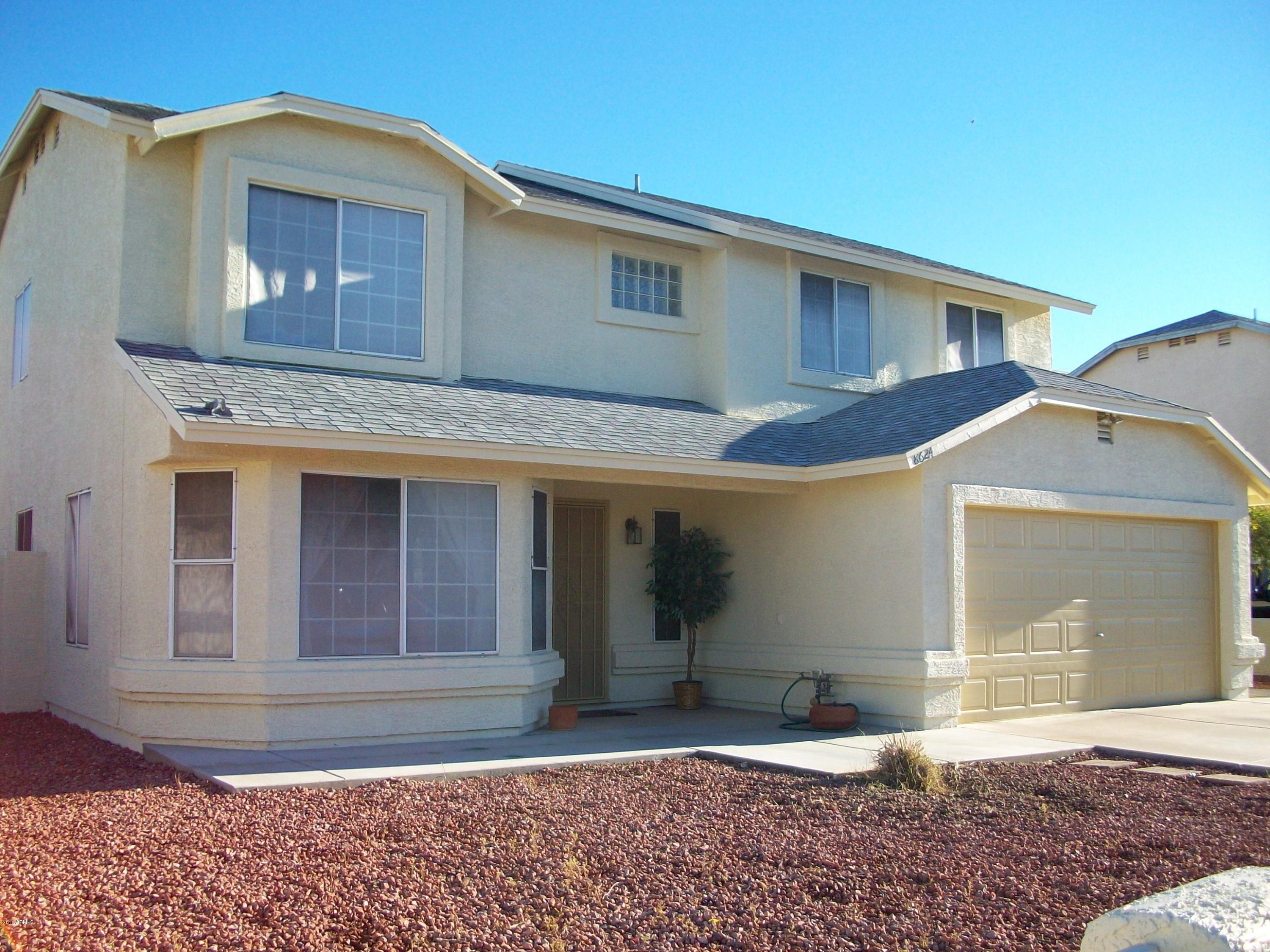 8624 West Monte Vista Road Phoenix, AZ 85037 - Photo 33 of 43 Desert lawn in front
