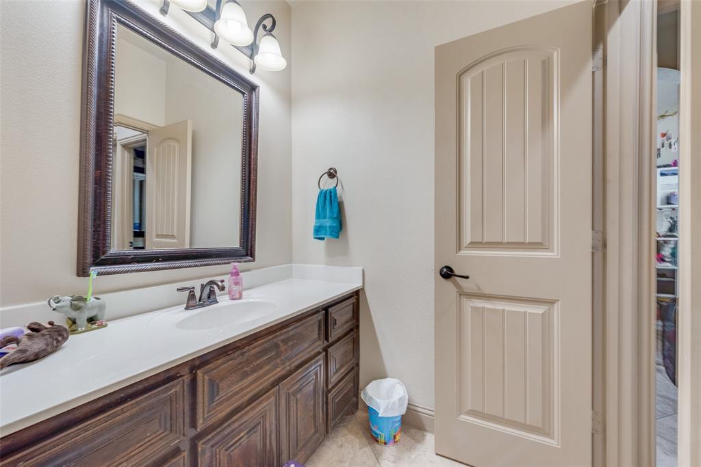 5056 Empire Way Irving, TX 75038 - Photo 27 of 39 Bathroom #5 Jack and Jill Bathroom with vanity and tile patterned floors