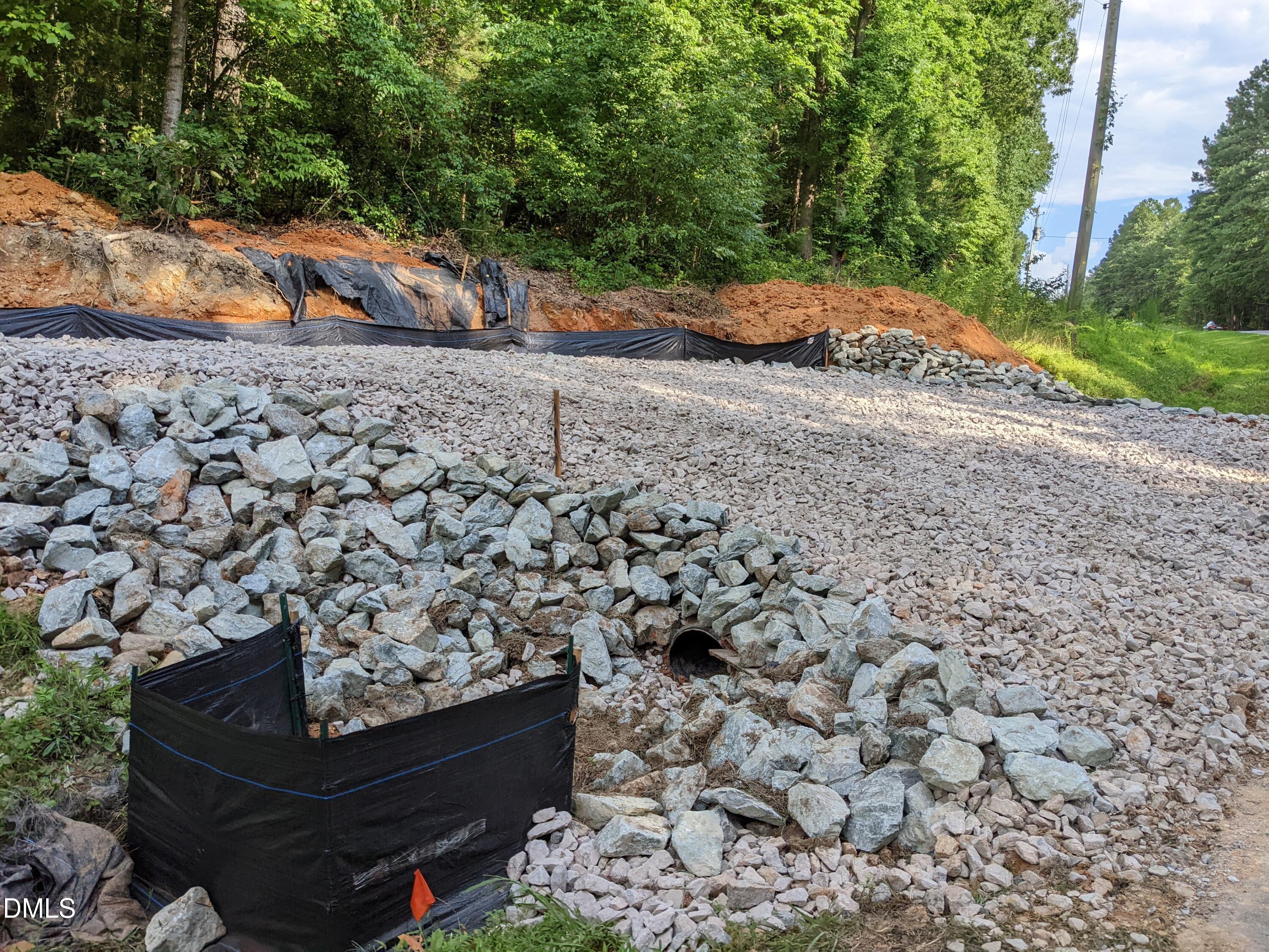 318 Jones Ferry Road Pittsboro, NC 27312 - Photo 15 of 17 a backyard of a house with lots of green space