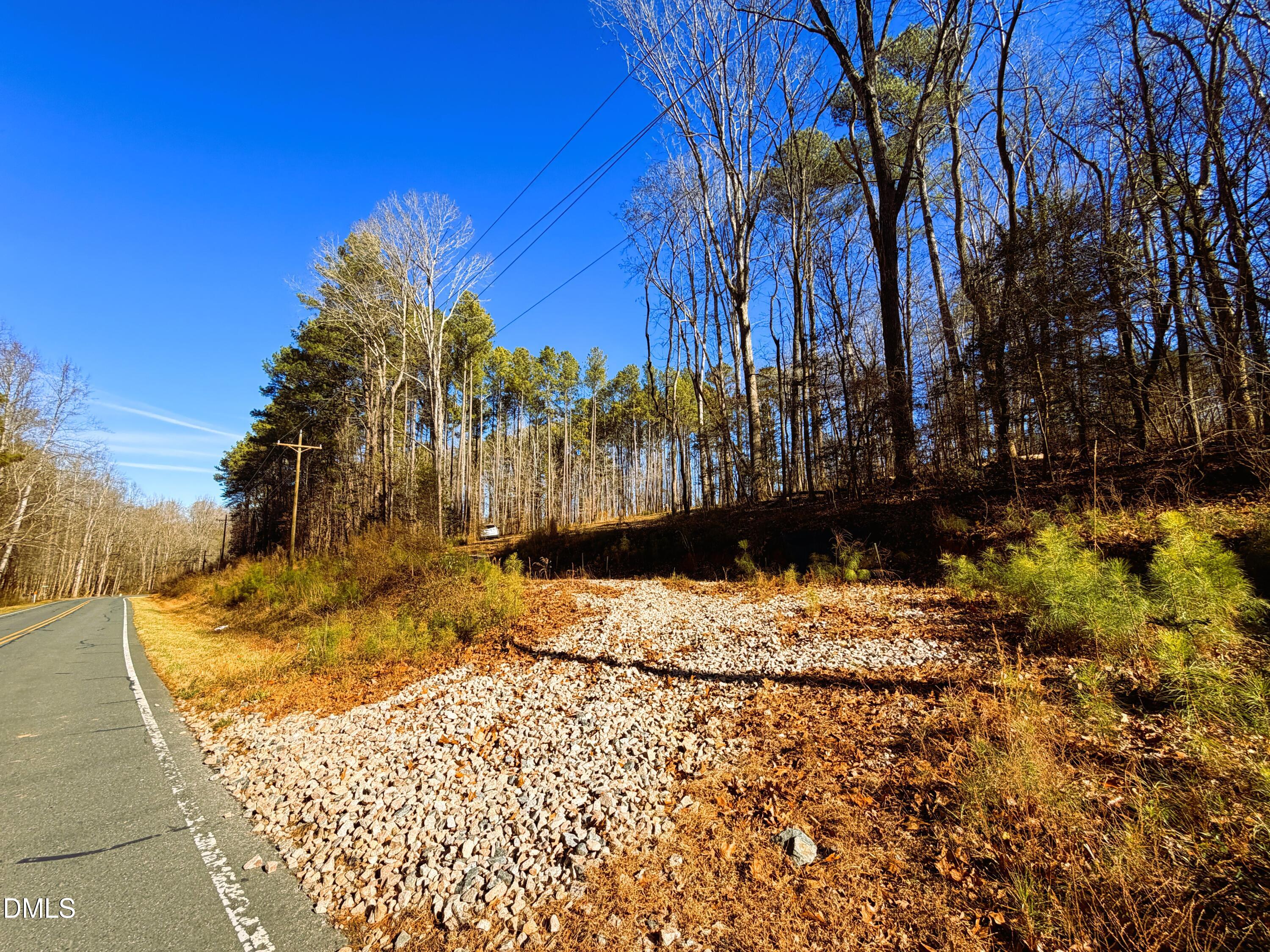 318 Jones Ferry Road Pittsboro, NC 27312 - Photo 8 of 17 a view of a yard with wooden fence