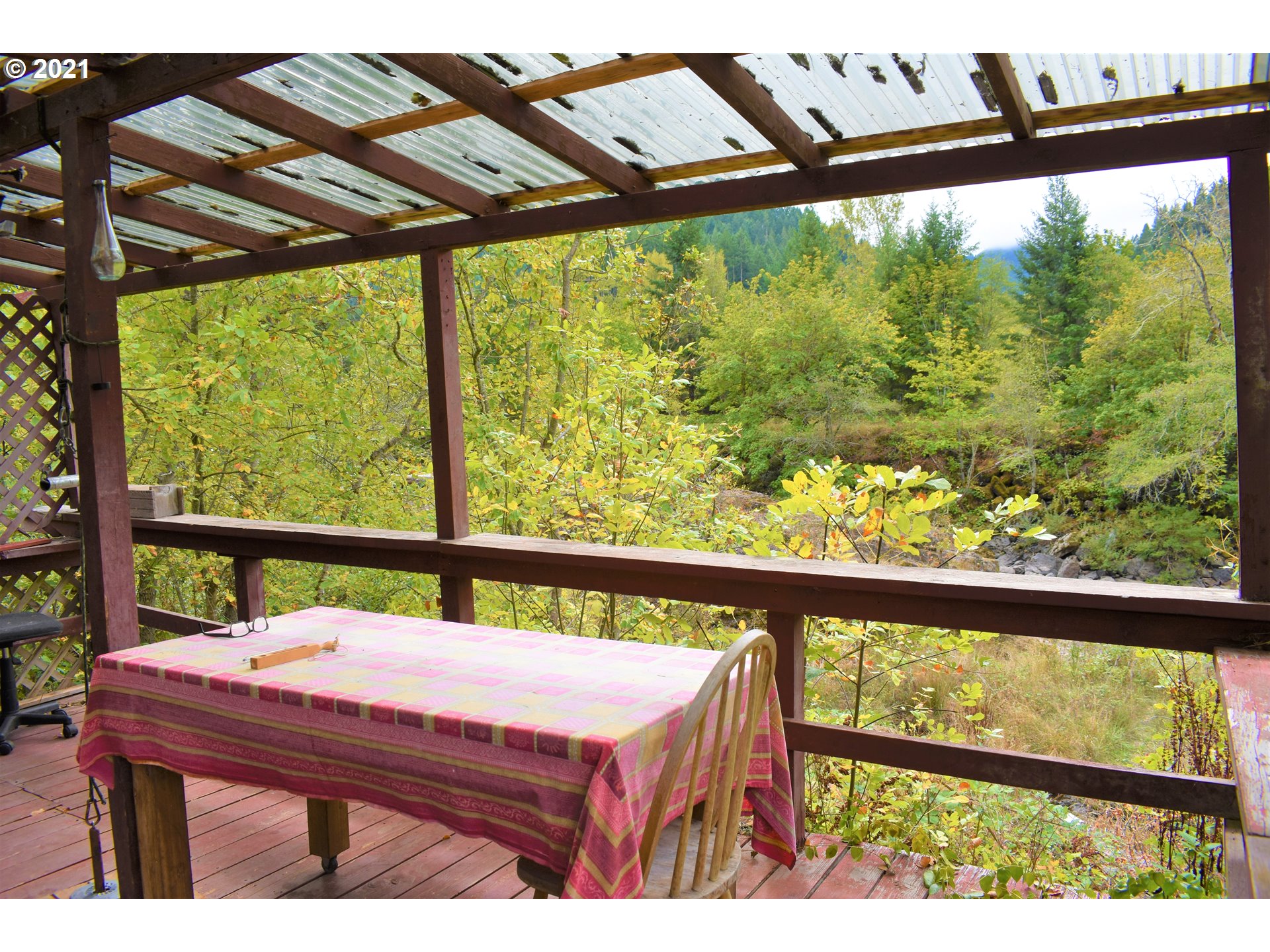 37824 Row River Road Dorena, OR 97434 - Photo 16 of 25 a view of a porch with furniture and wooden floor
