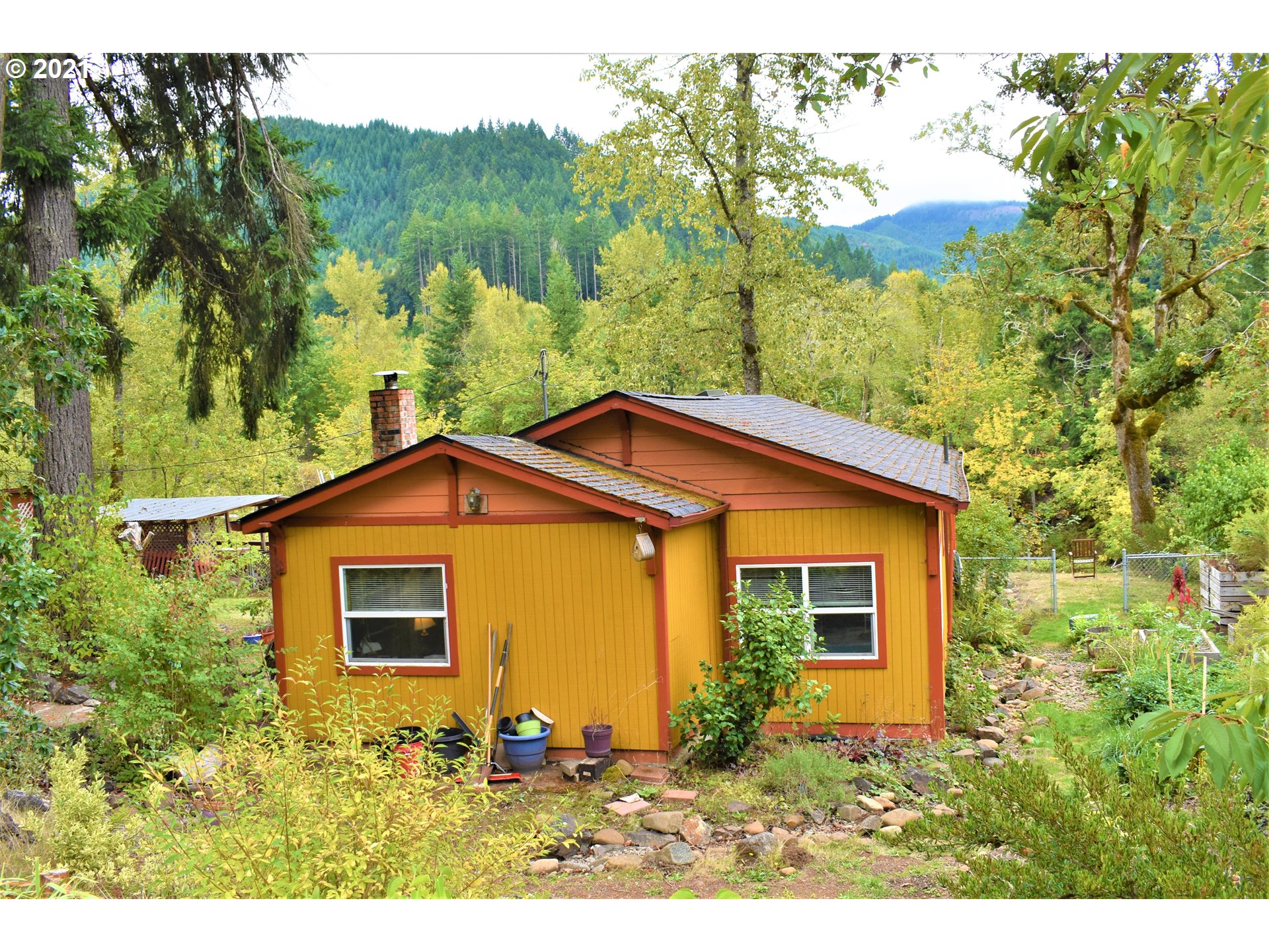 37824 Row River Road Dorena, OR 97434 - Photo 20 of 25 a view of a house with a yard