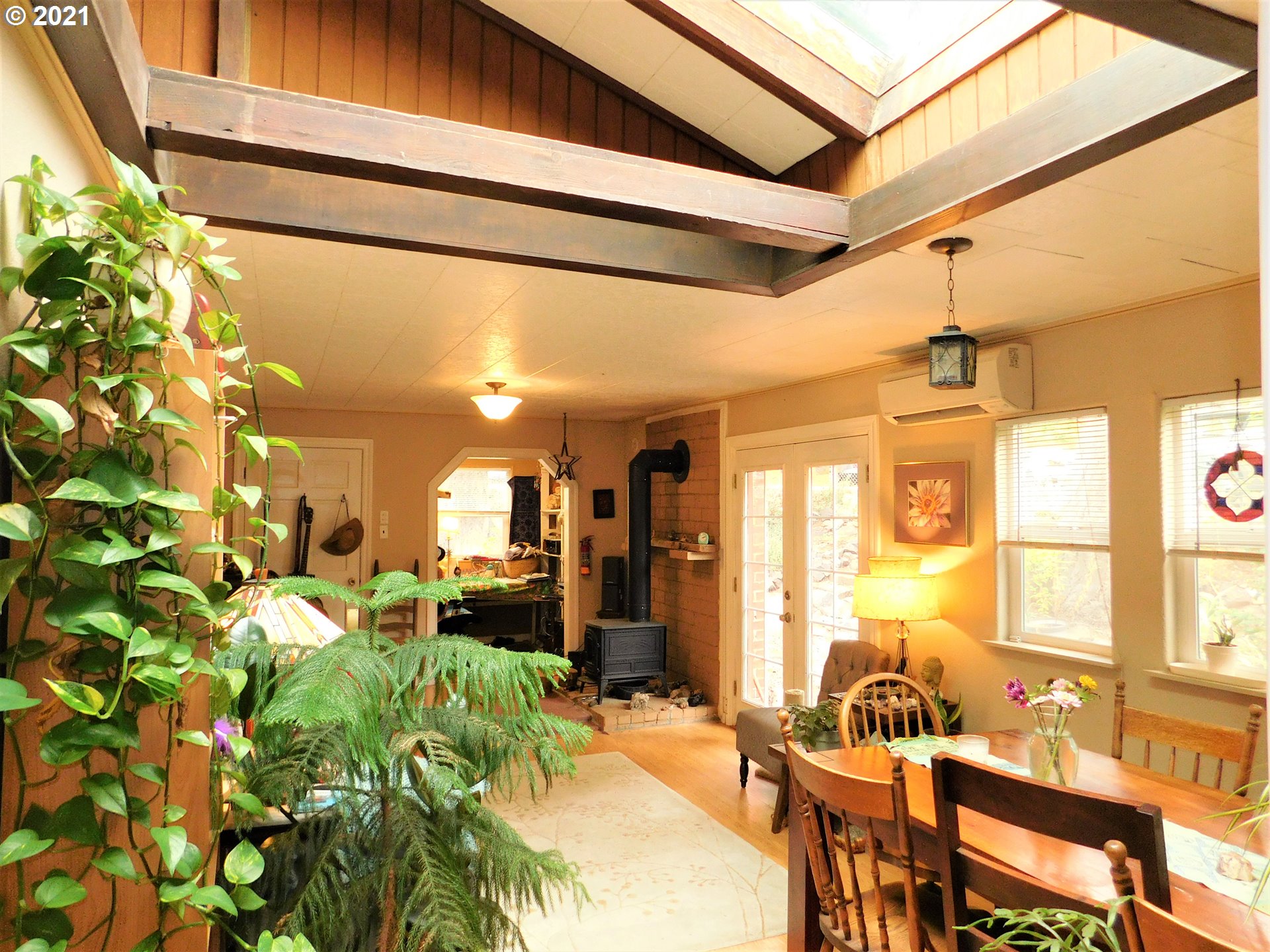 37824 Row River Road Dorena, OR 97434 - Photo 4 of 25 a view of a dining room with furniture a chandelier and a window
