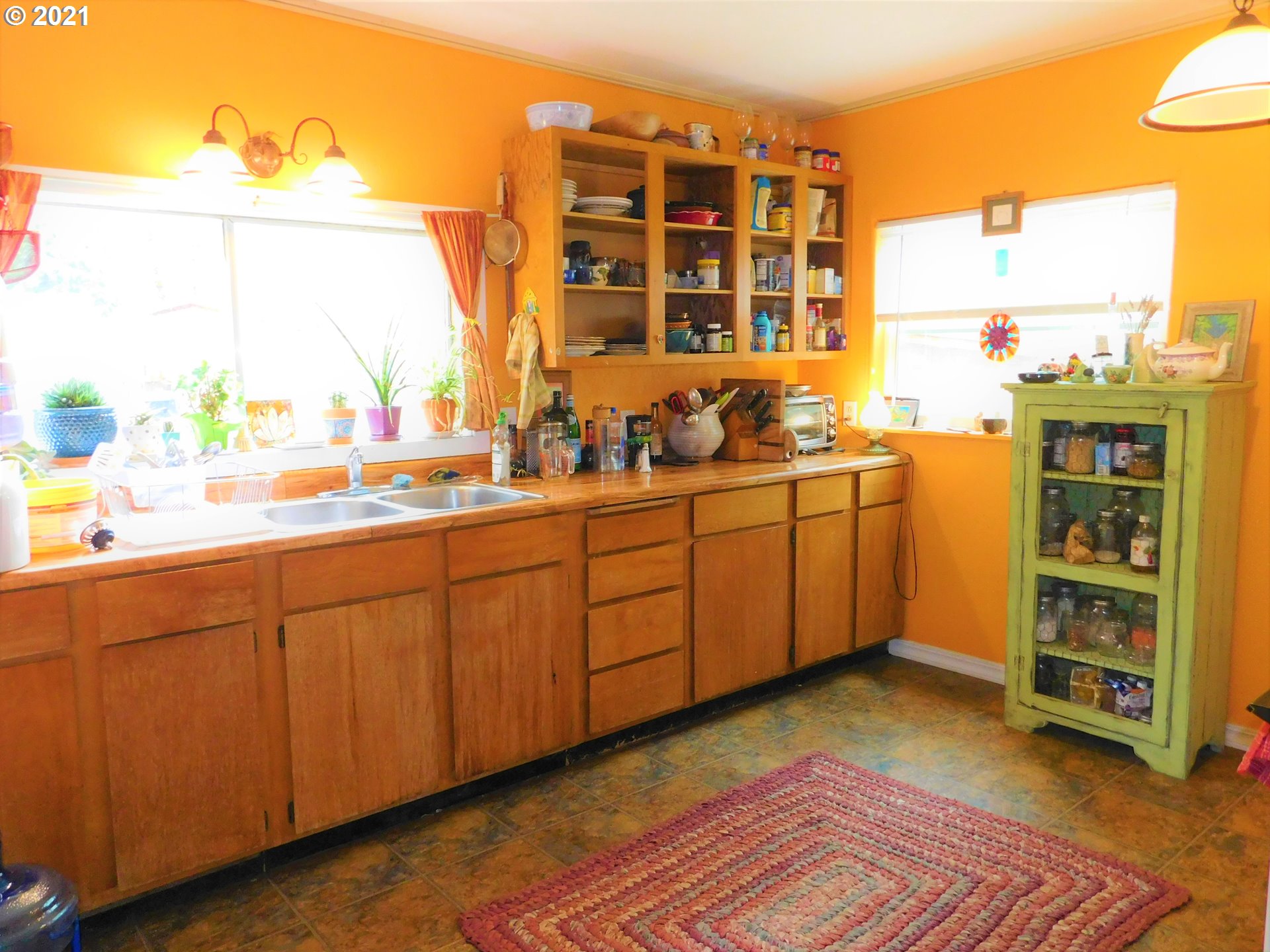 37824 Row River Road Dorena, OR 97434 - Photo 6 of 25 a kitchen with a sink and cabinets