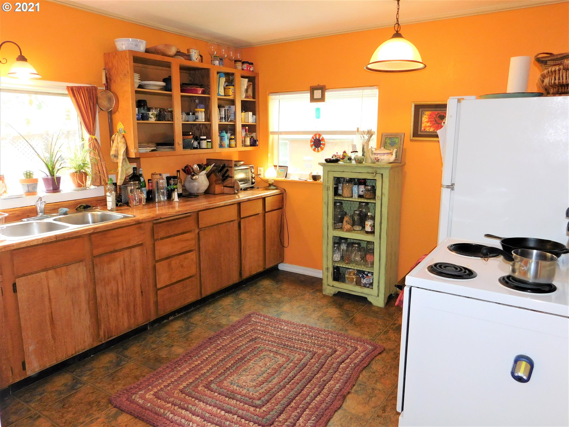 37824 Row River Road Dorena, OR 97434 - Photo 7 of 25 a kitchen with stainless steel appliances a stove a sink and a refrigerator