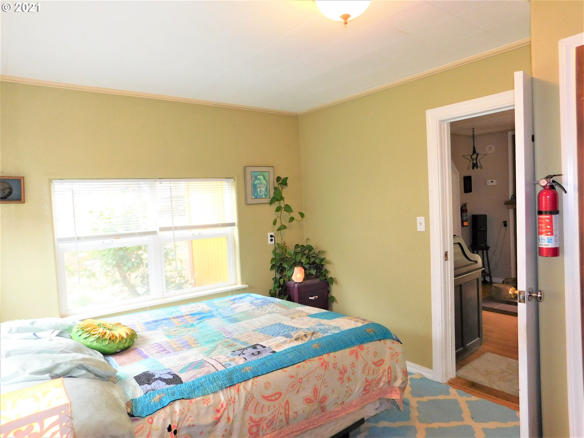 37824 Row River Road Dorena, OR 97434 - Photo 10 of 25 a bedroom with a bed and a window