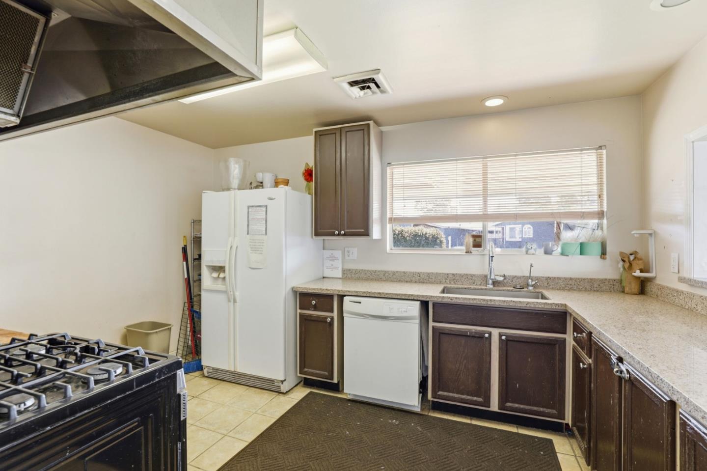20 Russell Road, Unit 8 Salinas, CA 93906 - Photo 34 of 38 a kitchen with a sink stove and refrigerator