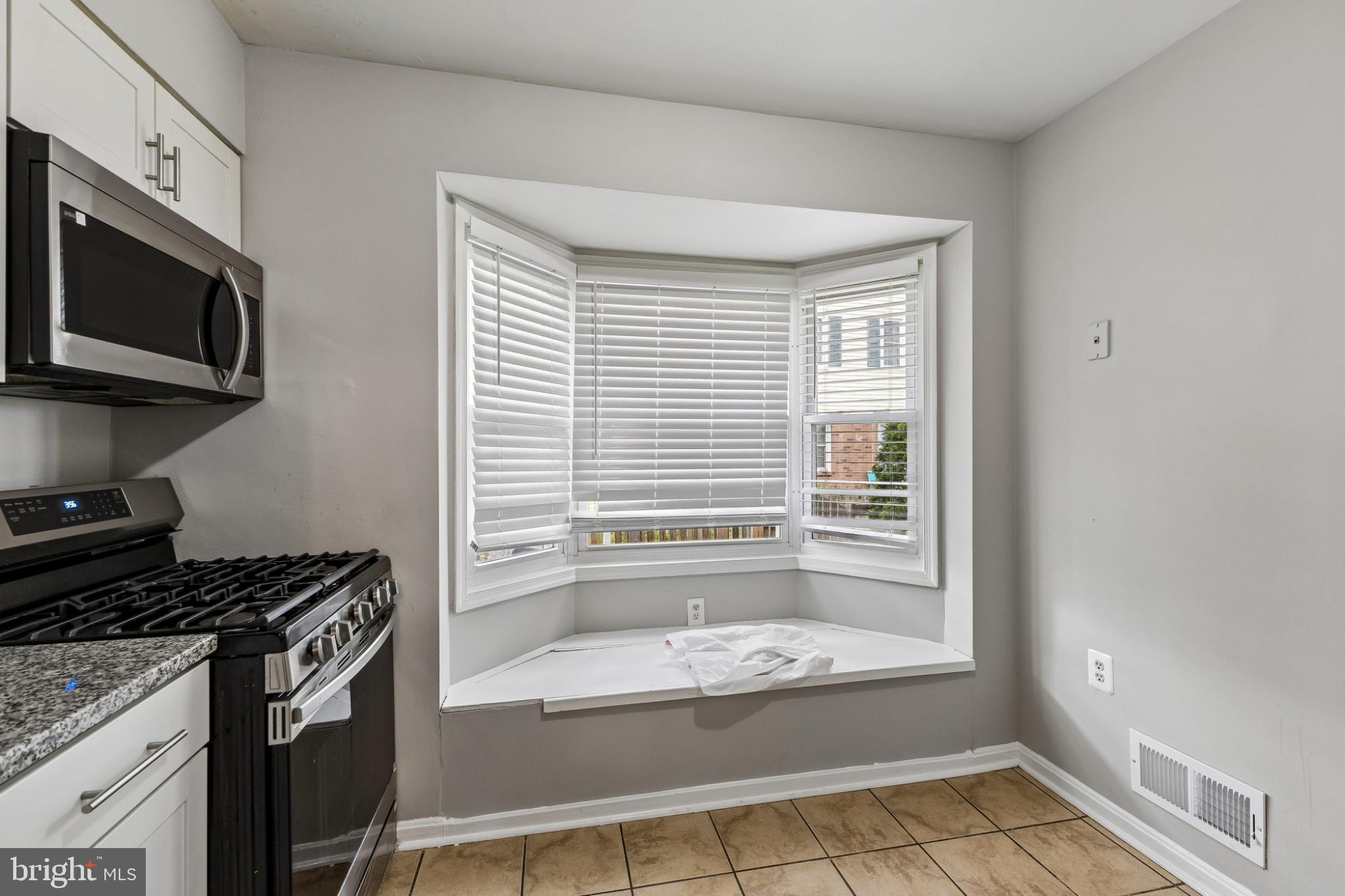 7974 Community Drive Manassas, VA 20109 - Photo 11 of 27 Bright kitchen with cozy bay window.