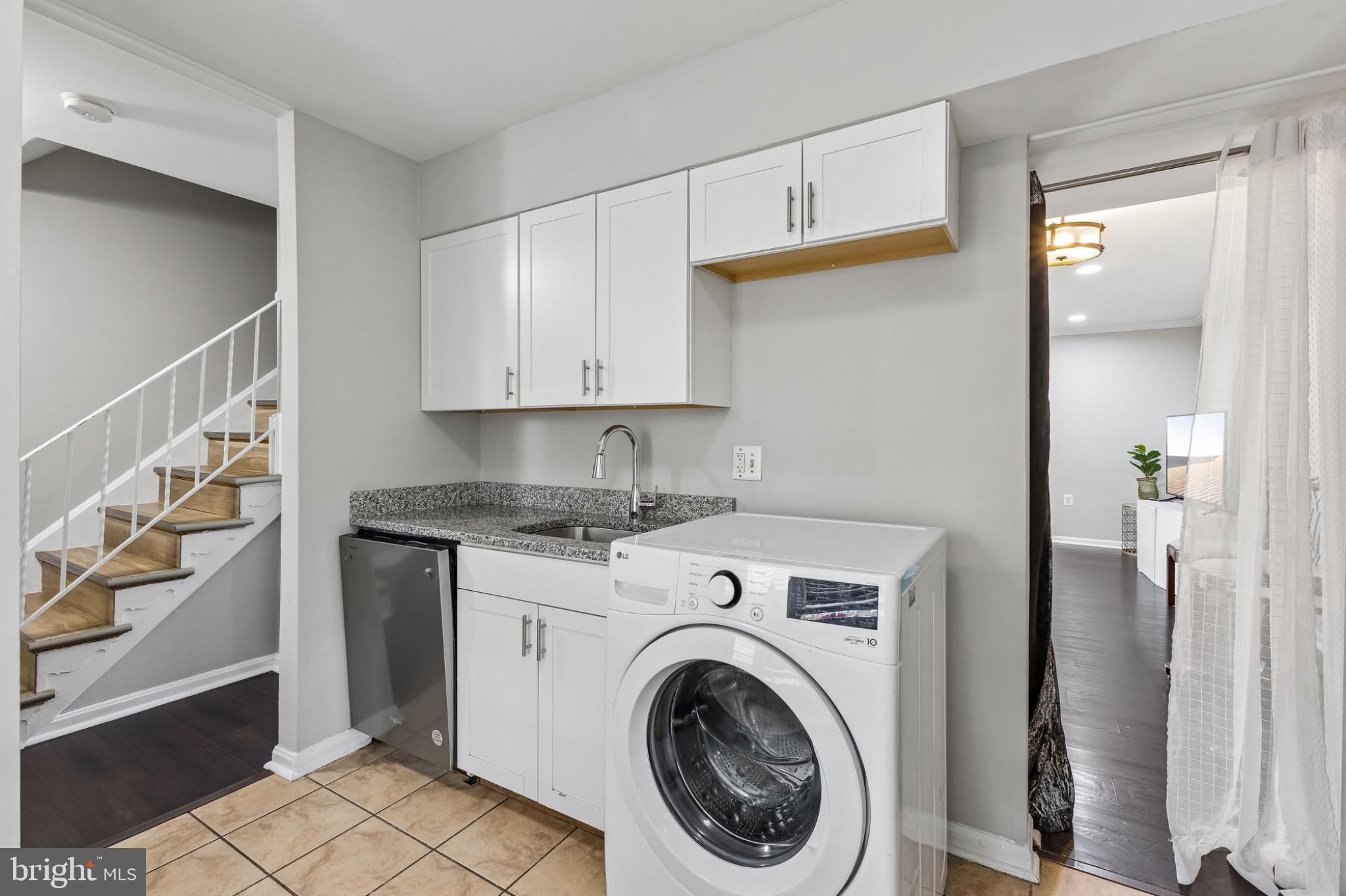7974 Community Drive Manassas, VA 20109 - Photo 12 of 27 Modern laundry nook with sleek finishes.