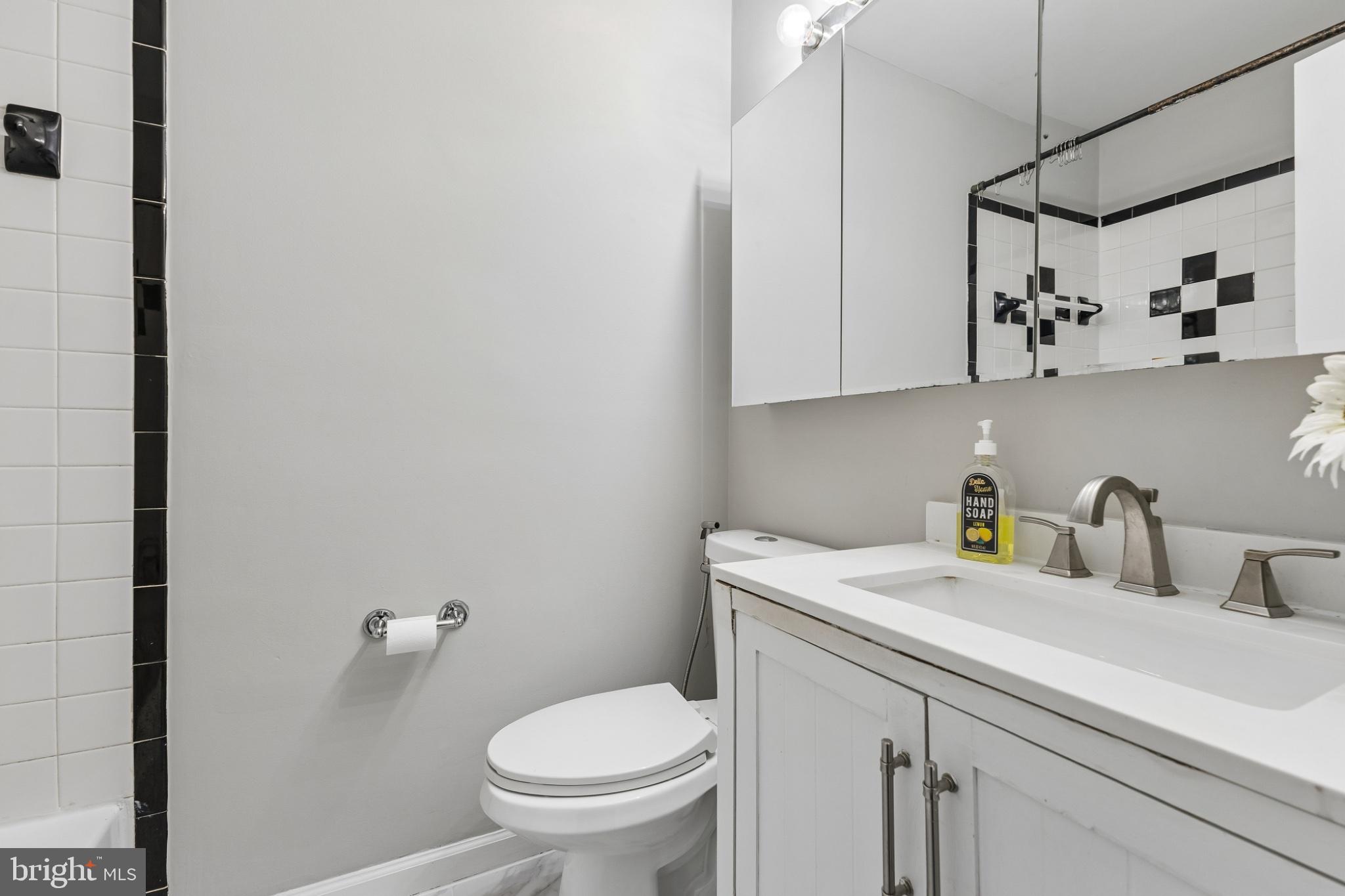 7974 Community Drive Manassas, VA 20109 - Photo 13 of 27 Sleek modern bathroom with chic accents.