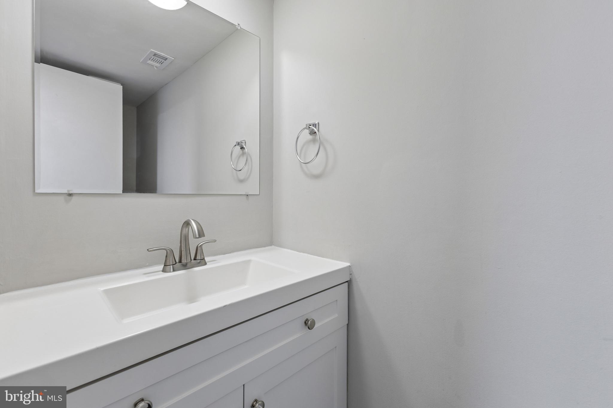 7974 Community Drive Manassas, VA 20109 - Photo 16 of 27 Sleek and modern bathroom oasis.