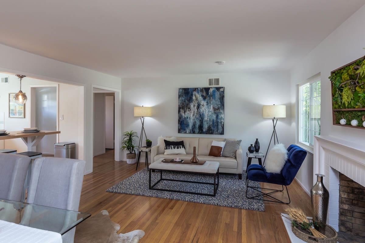 822 Springer Road Los Altos, CA 94024 - Photo 4 of 25 a living room with furniture and a fireplace