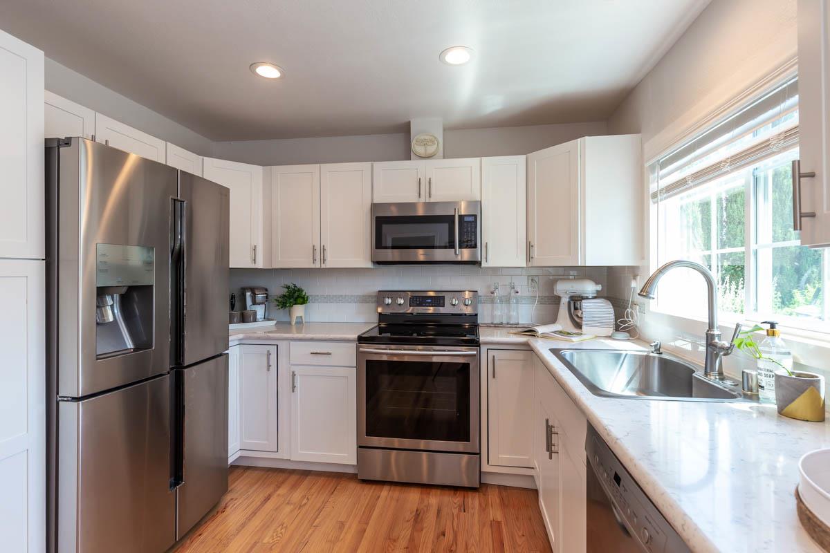 822 Springer Road Los Altos, CA 94024 - Photo 8 of 25 a kitchen with refrigerator a stove a sink and a microwave