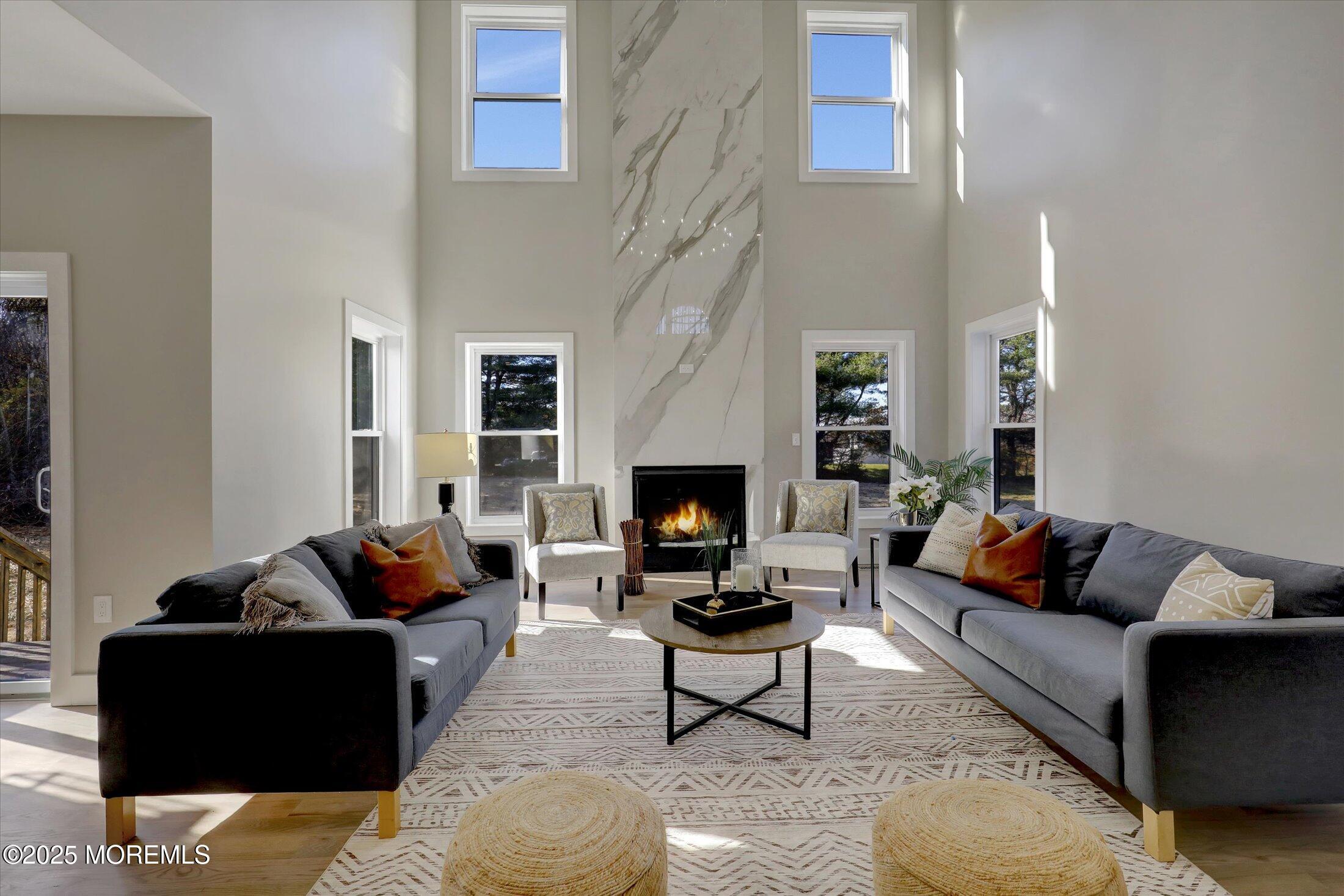 750 Holmdel Road Holmdel, NJ 07733 - Photo 11 of 55 a living room with furniture and a fireplace