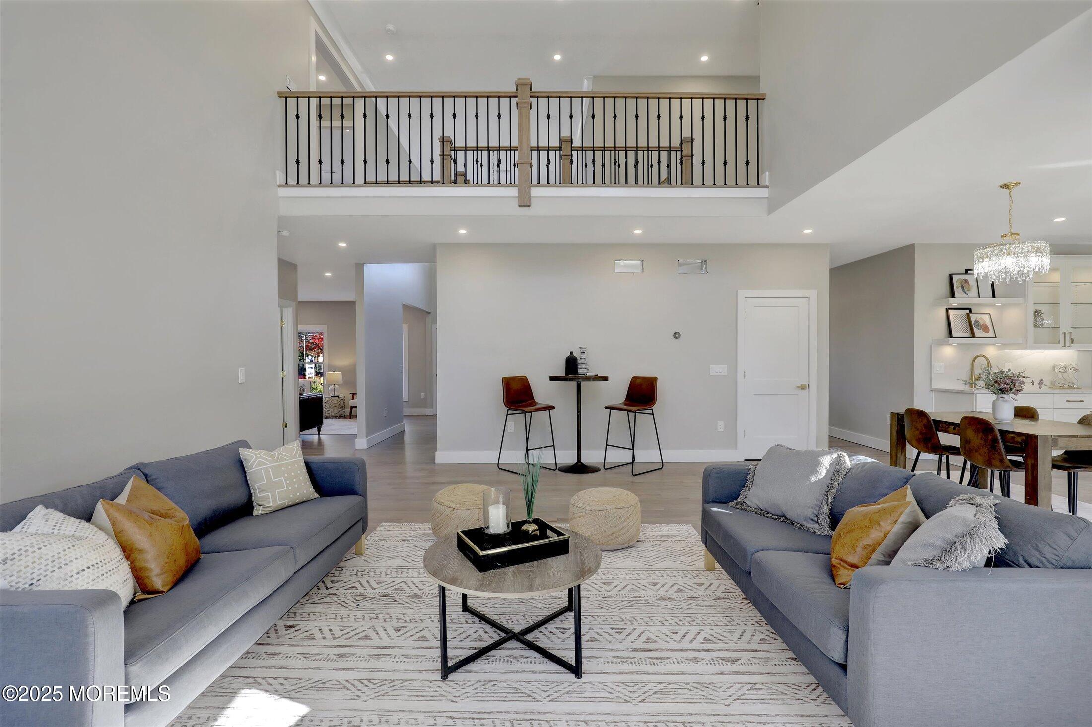 750 Holmdel Road Holmdel, NJ 07733 - Photo 13 of 55 a living room with furniture and kitchen view