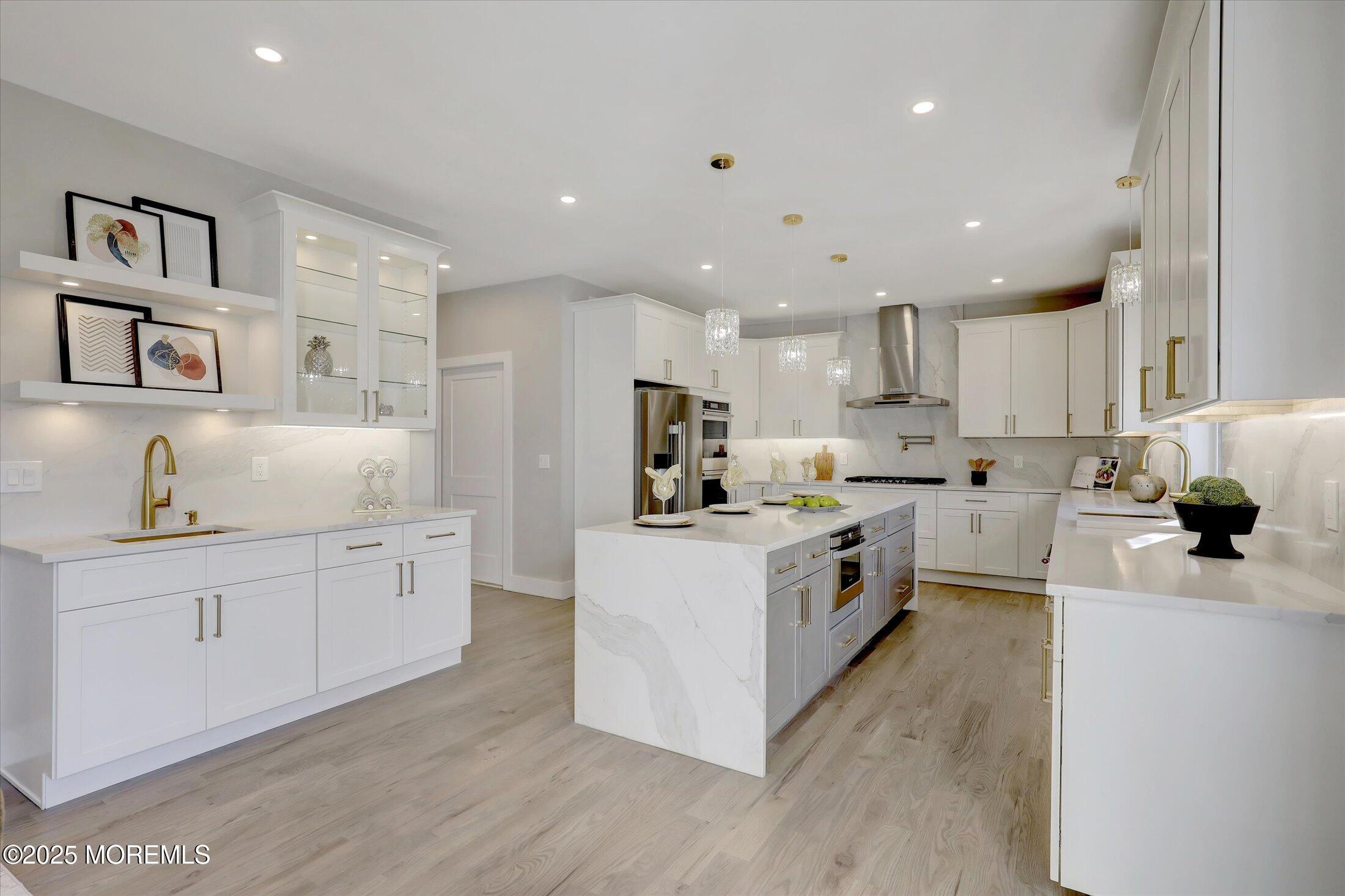 750 Holmdel Road Holmdel, NJ 07733 - Photo 15 of 55 a kitchen with white cabinets and white appliances