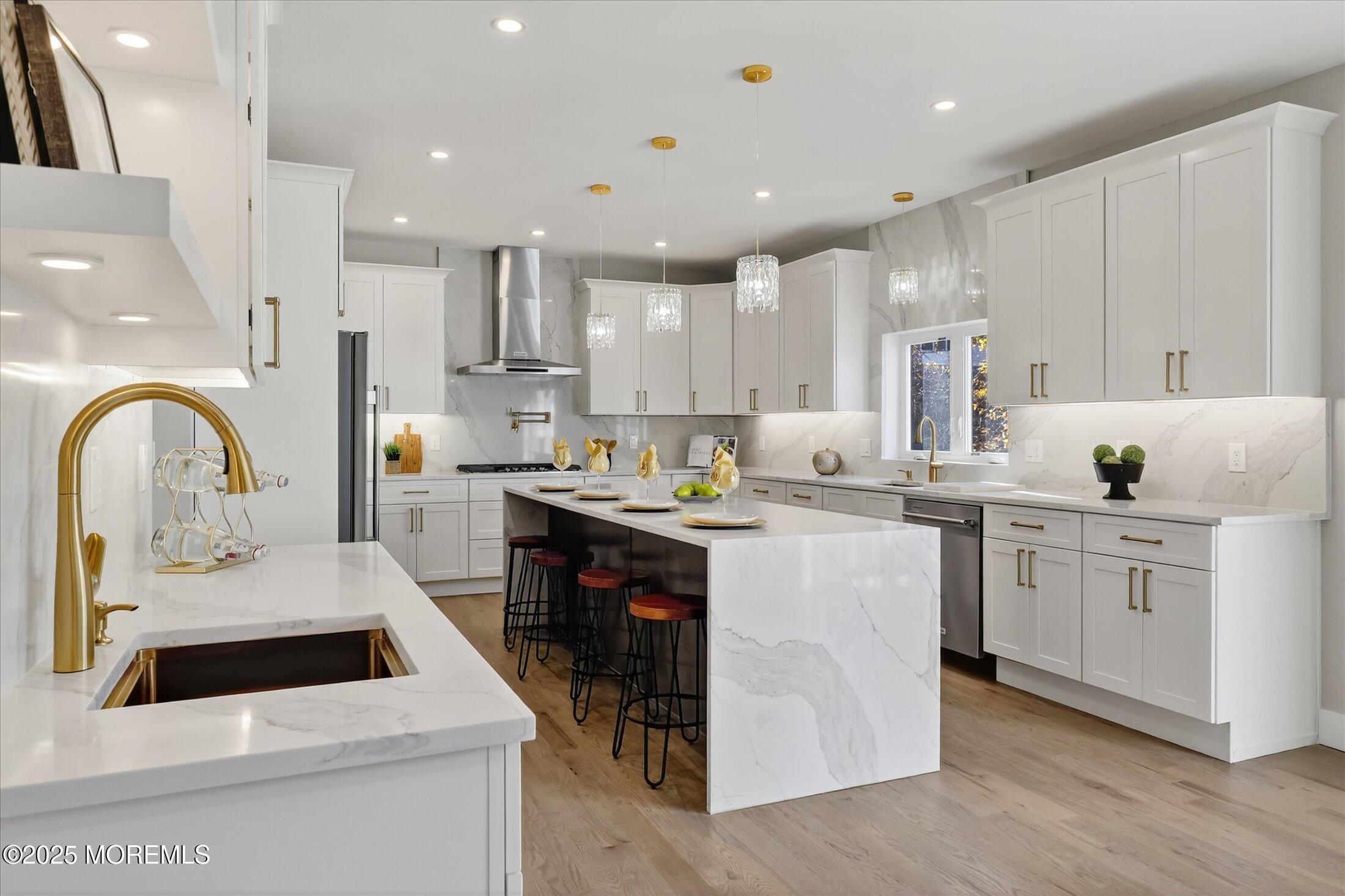750 Holmdel Road Holmdel, NJ 07733 - Photo 16 of 55 a kitchen with white cabinets appliances and a sink