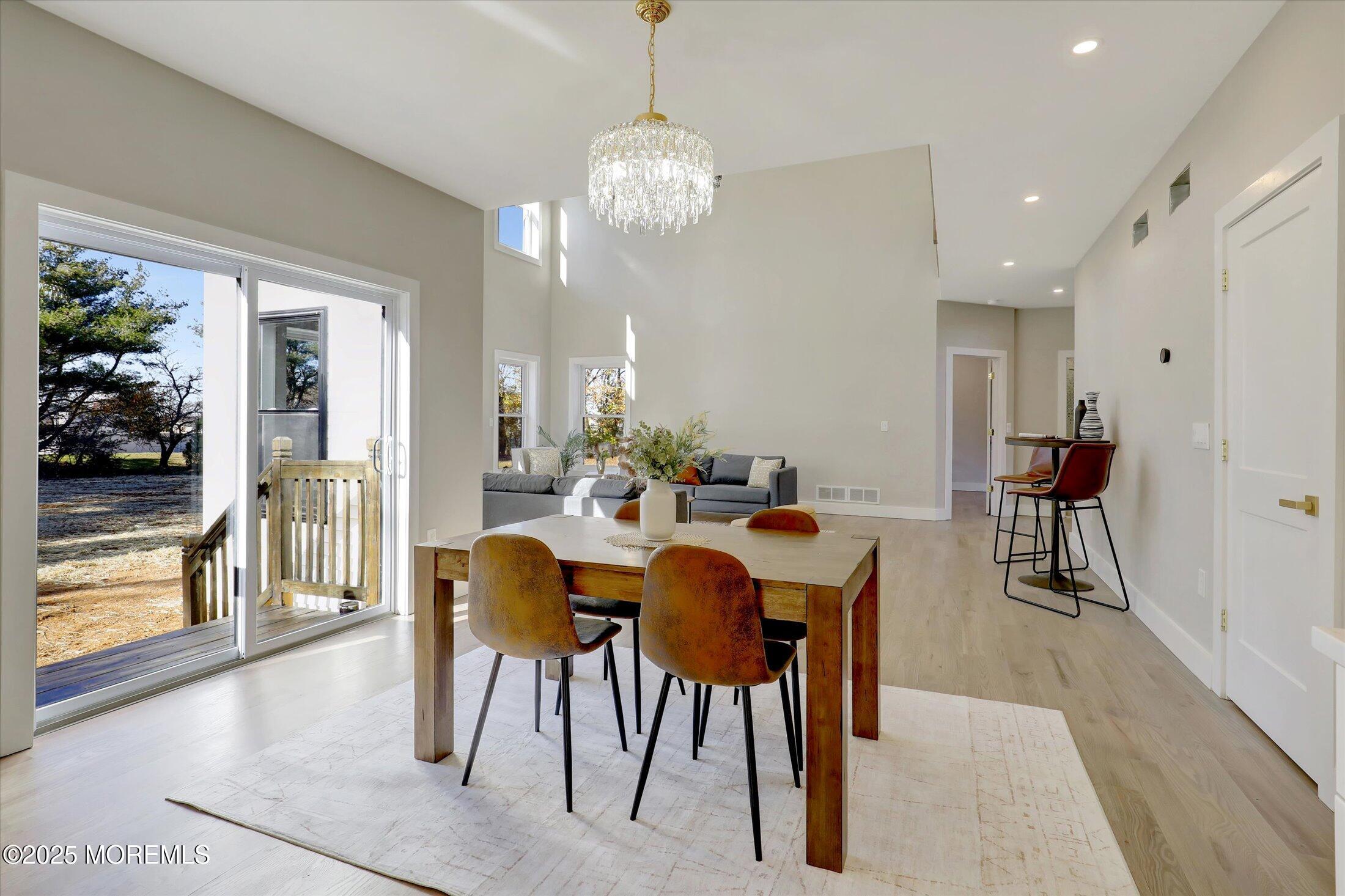 750 Holmdel Road Holmdel, NJ 07733 - Photo 20 of 55 a view of a dining room with furniture and a chandelier