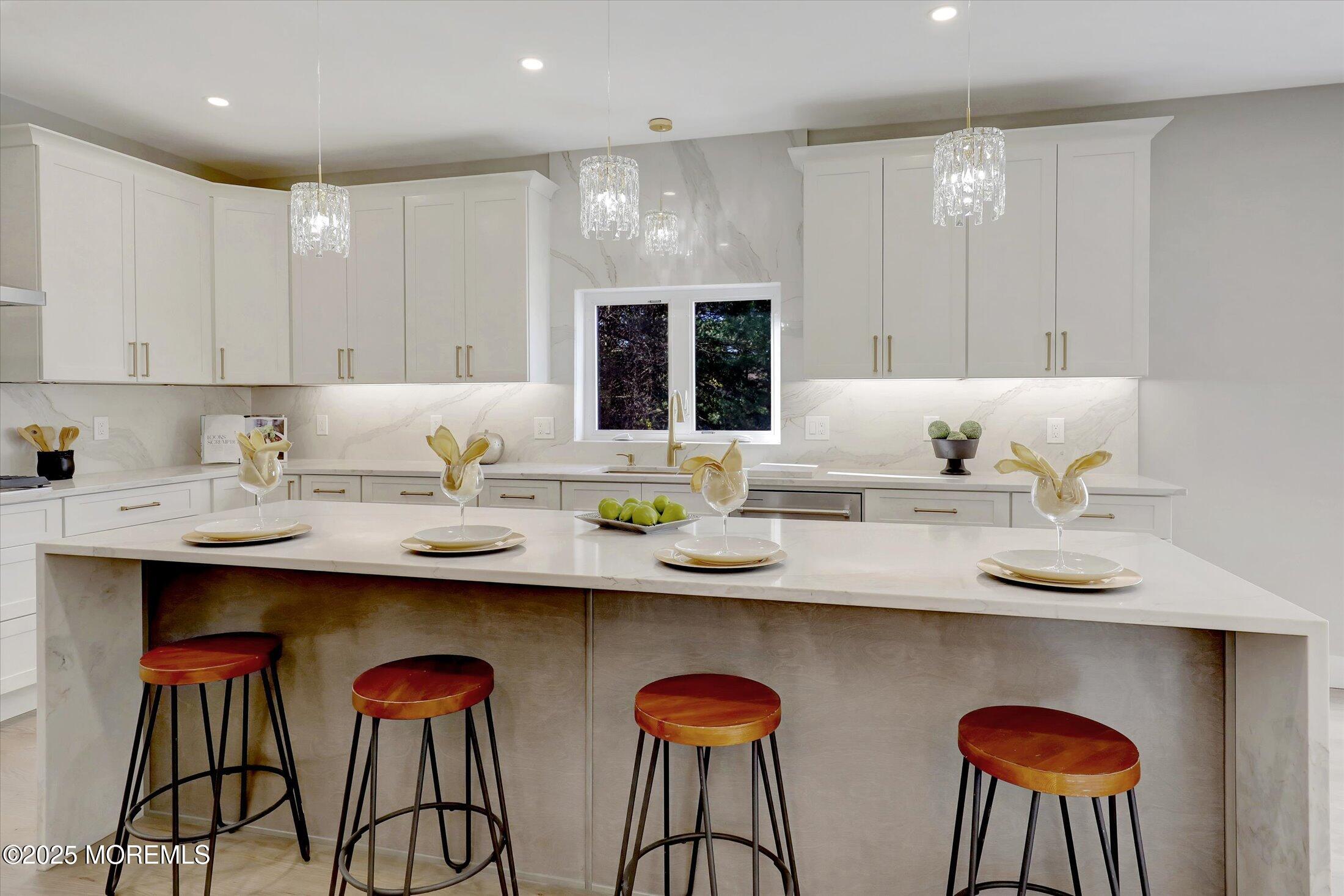 750 Holmdel Road Holmdel, NJ 07733 - Photo 21 of 55 a kitchen with stainless steel appliances granite countertop a sink and white cabinets