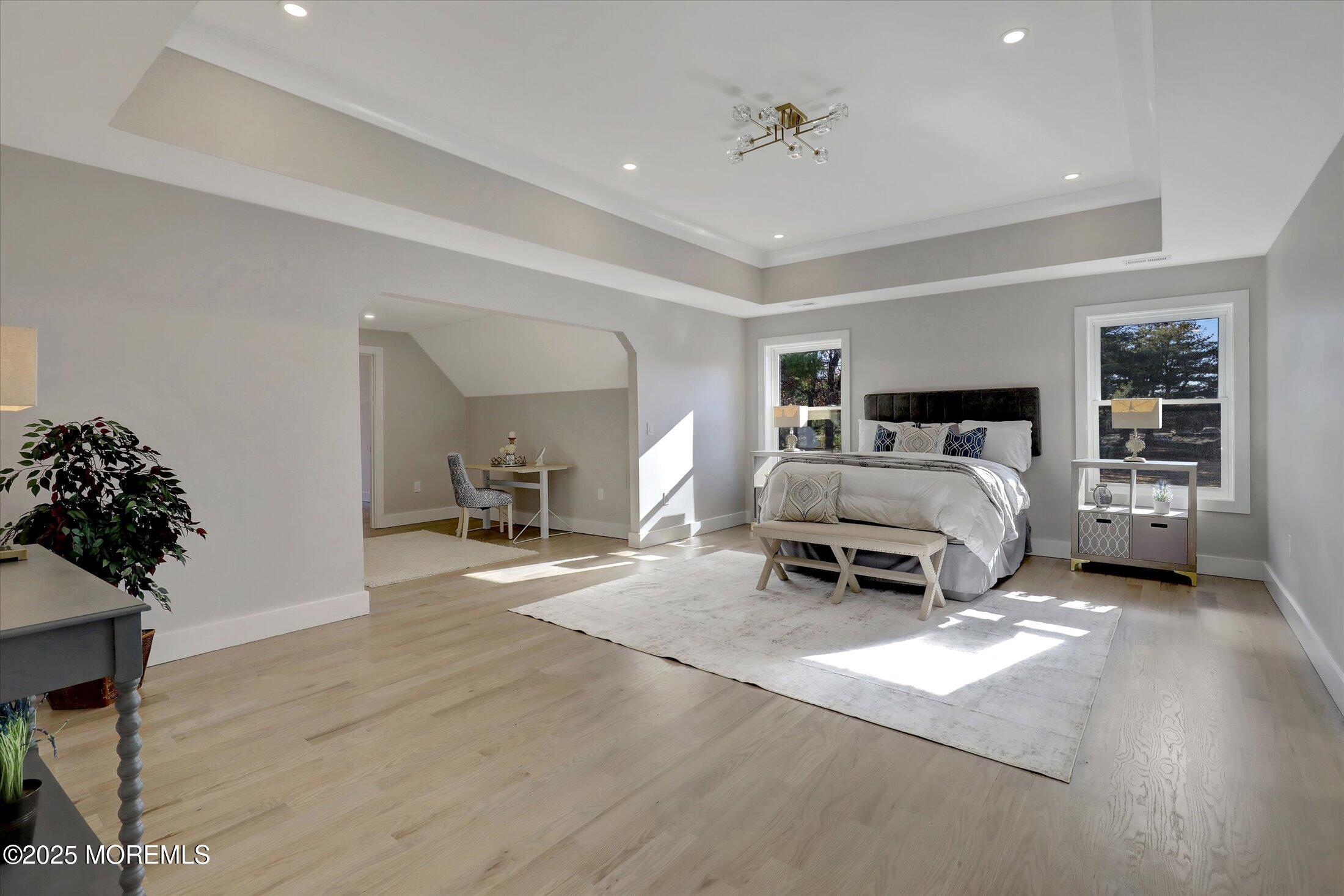 750 Holmdel Road Holmdel, NJ 07733 - Photo 29 of 55 a spacious bedroom with a bed and a couch