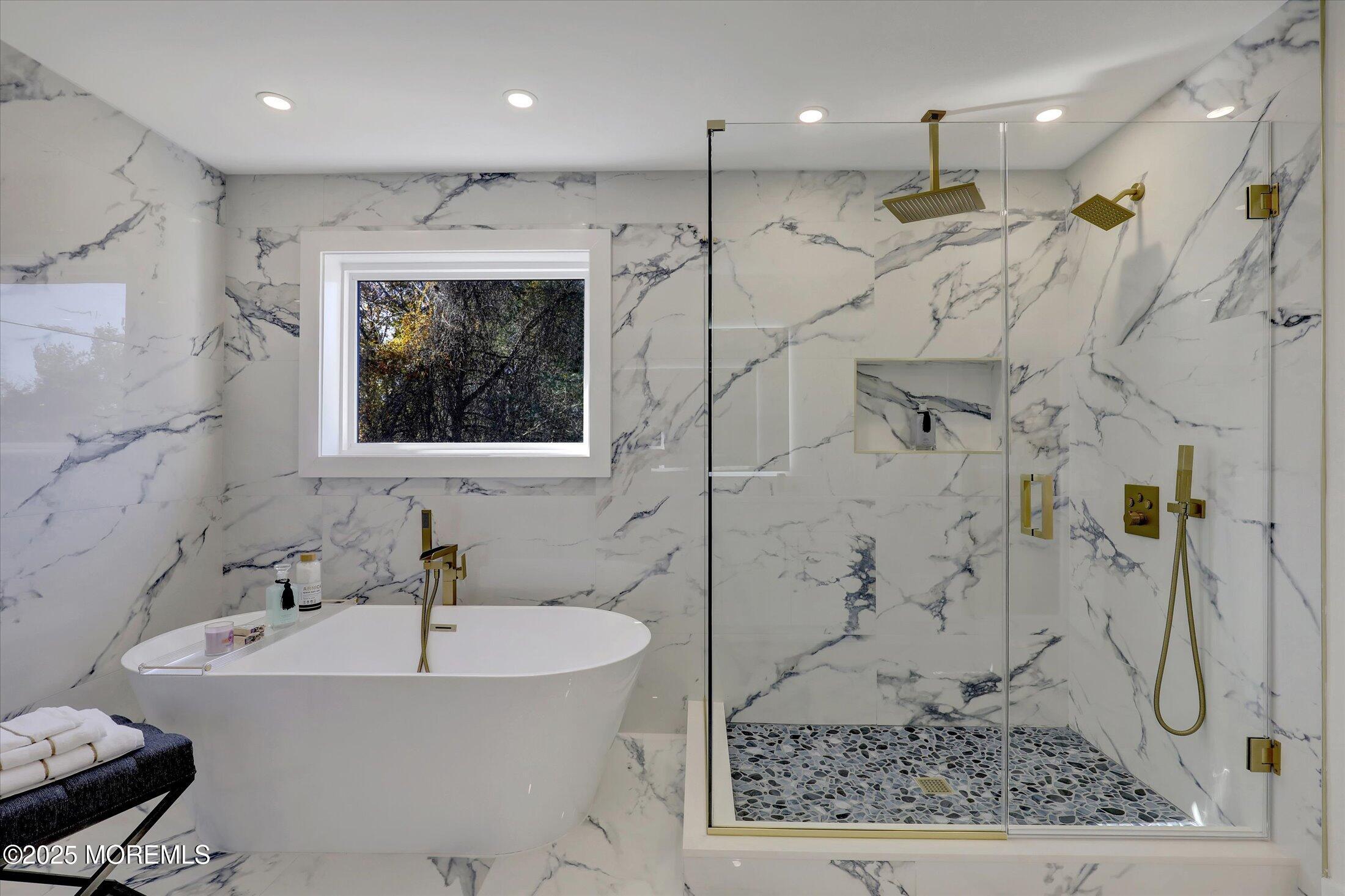 750 Holmdel Road Holmdel, NJ 07733 - Photo 36 of 55 a bathroom with a bathtub and a shower