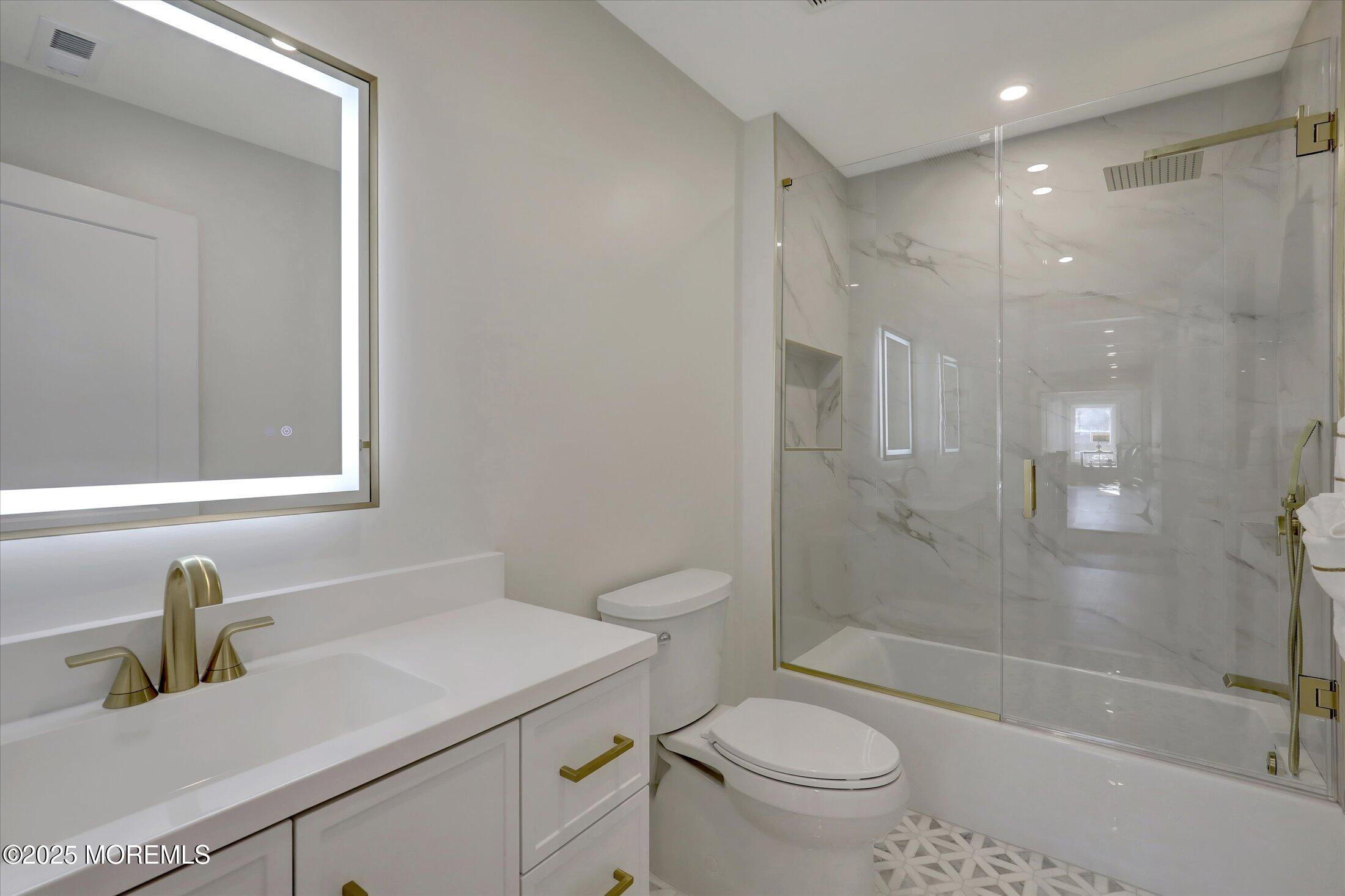 750 Holmdel Road Holmdel, NJ 07733 - Photo 41 of 55 a bathroom with a sink a toilet and shower