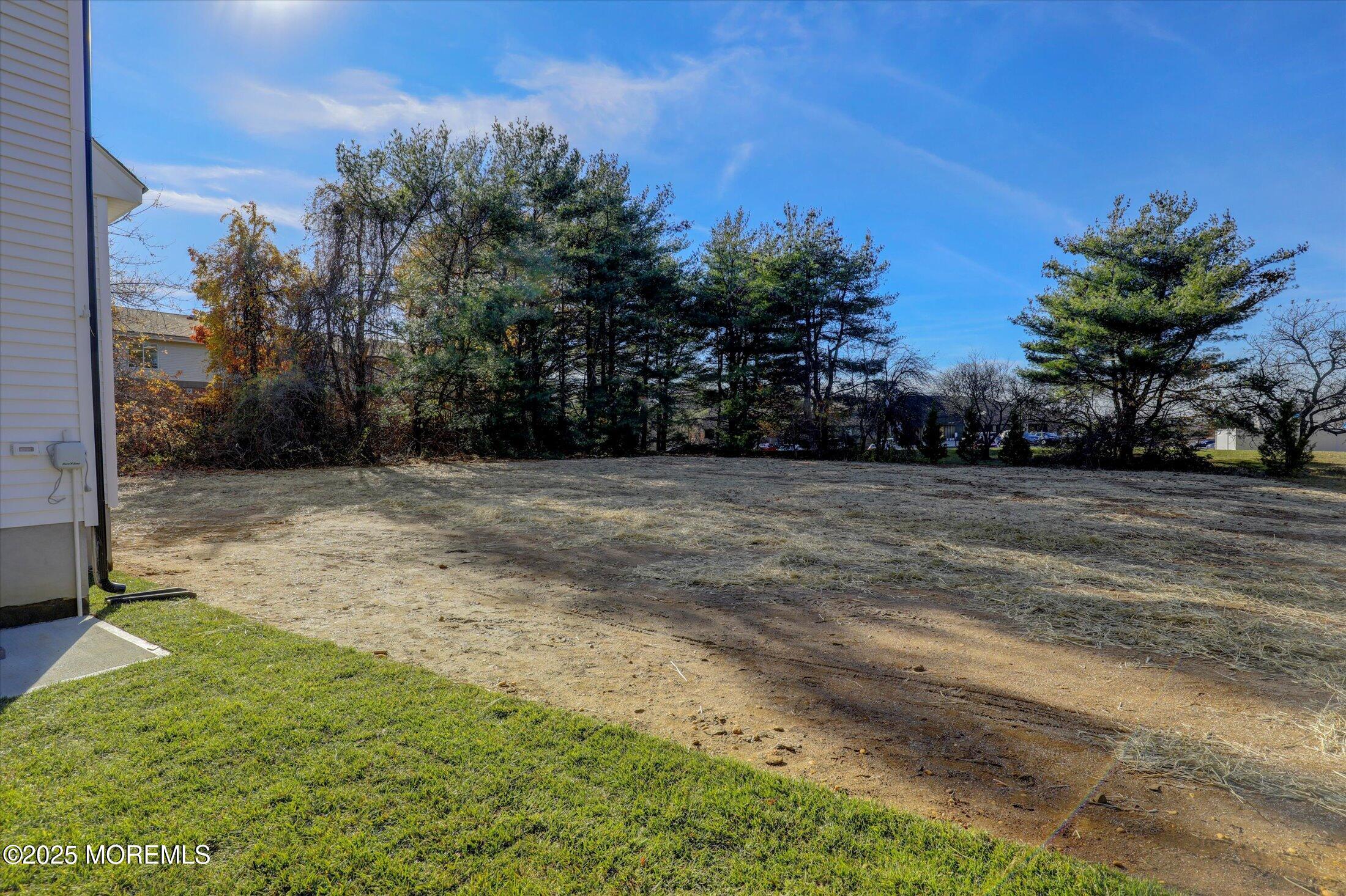 750 Holmdel Road Holmdel, NJ 07733 - Photo 47 of 55 a view of a yard with a house in the background