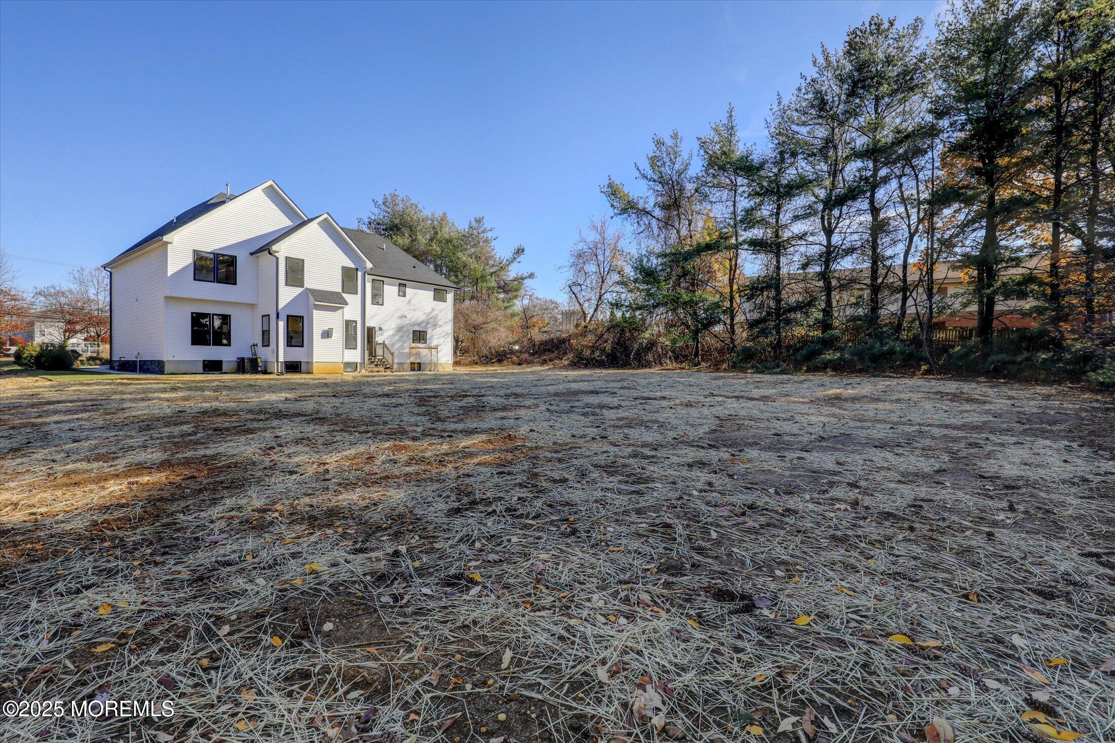 750 Holmdel Road Holmdel, NJ 07733 - Photo 48 of 55 a front view of a house with a yard