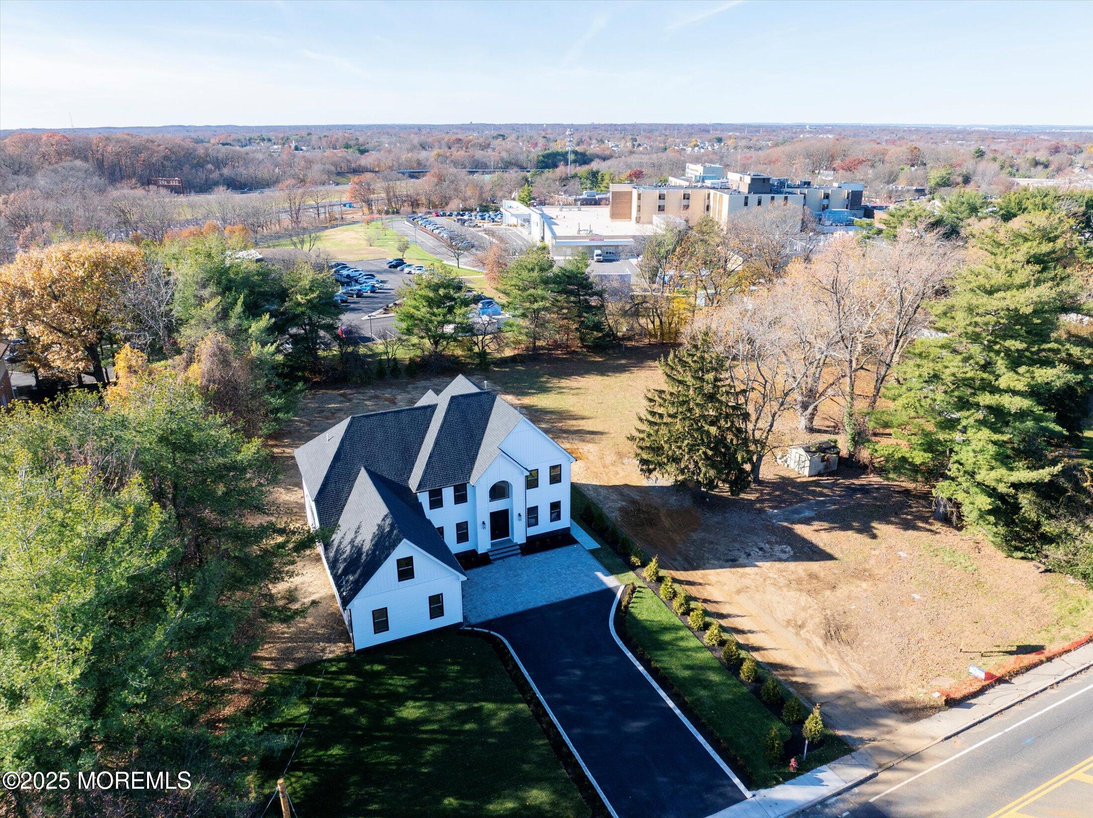 750 Holmdel Road Holmdel, NJ 07733 - Photo 53 of 55 an aerial view of a house with yard swimming pool and outdoor seating