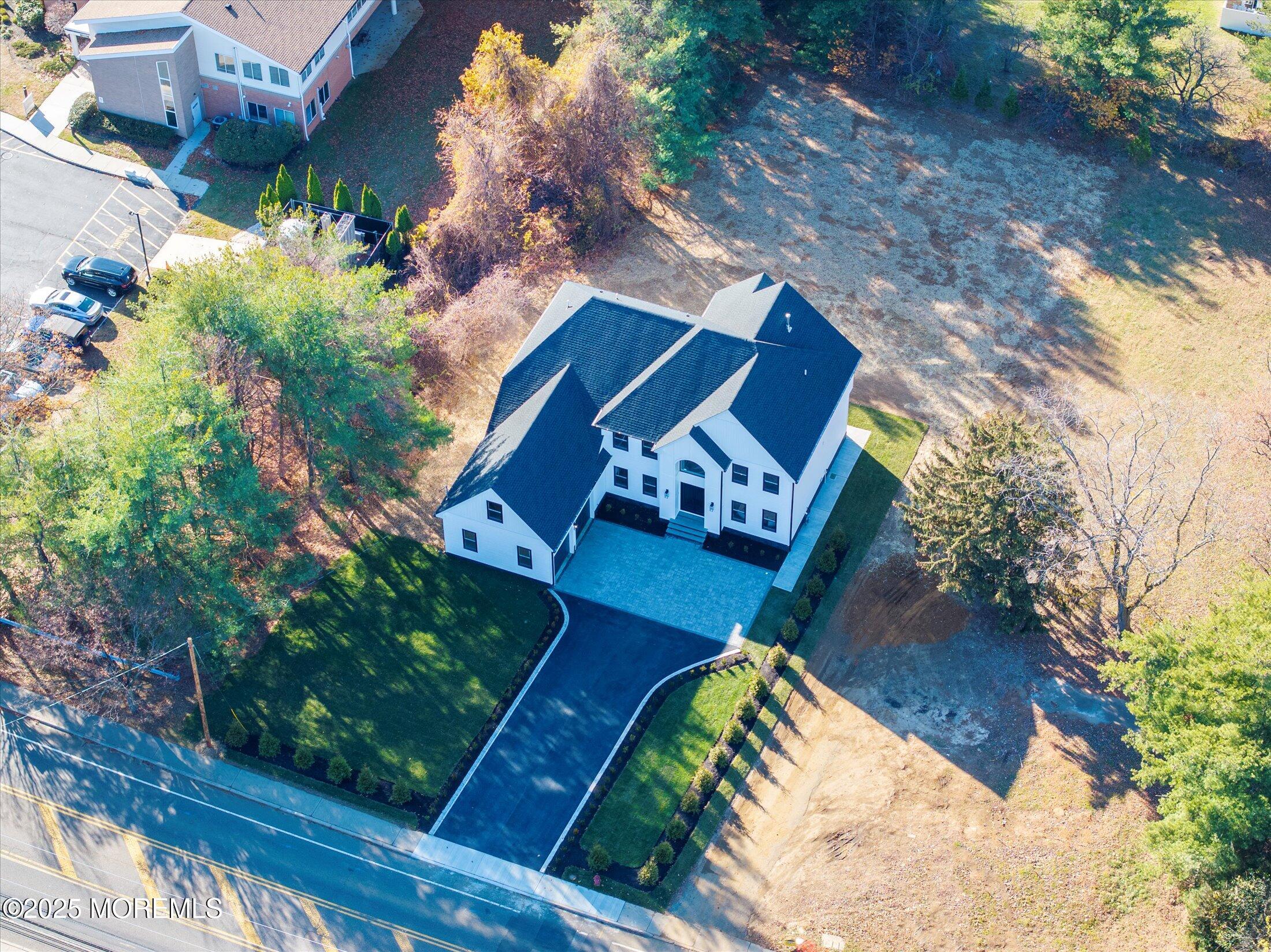 750 Holmdel Road Holmdel, NJ 07733 - Photo 54 of 55 an aerial view of a house a yard and outdoor seating