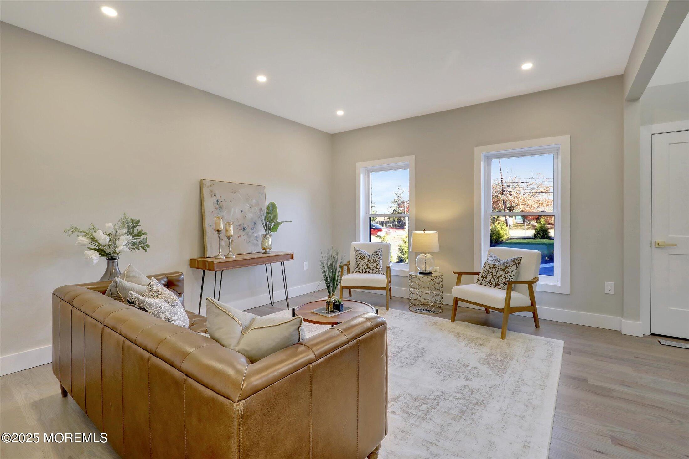 750 Holmdel Road Holmdel, NJ 07733 - Photo 7 of 55 a living room with furniture and wooden floor