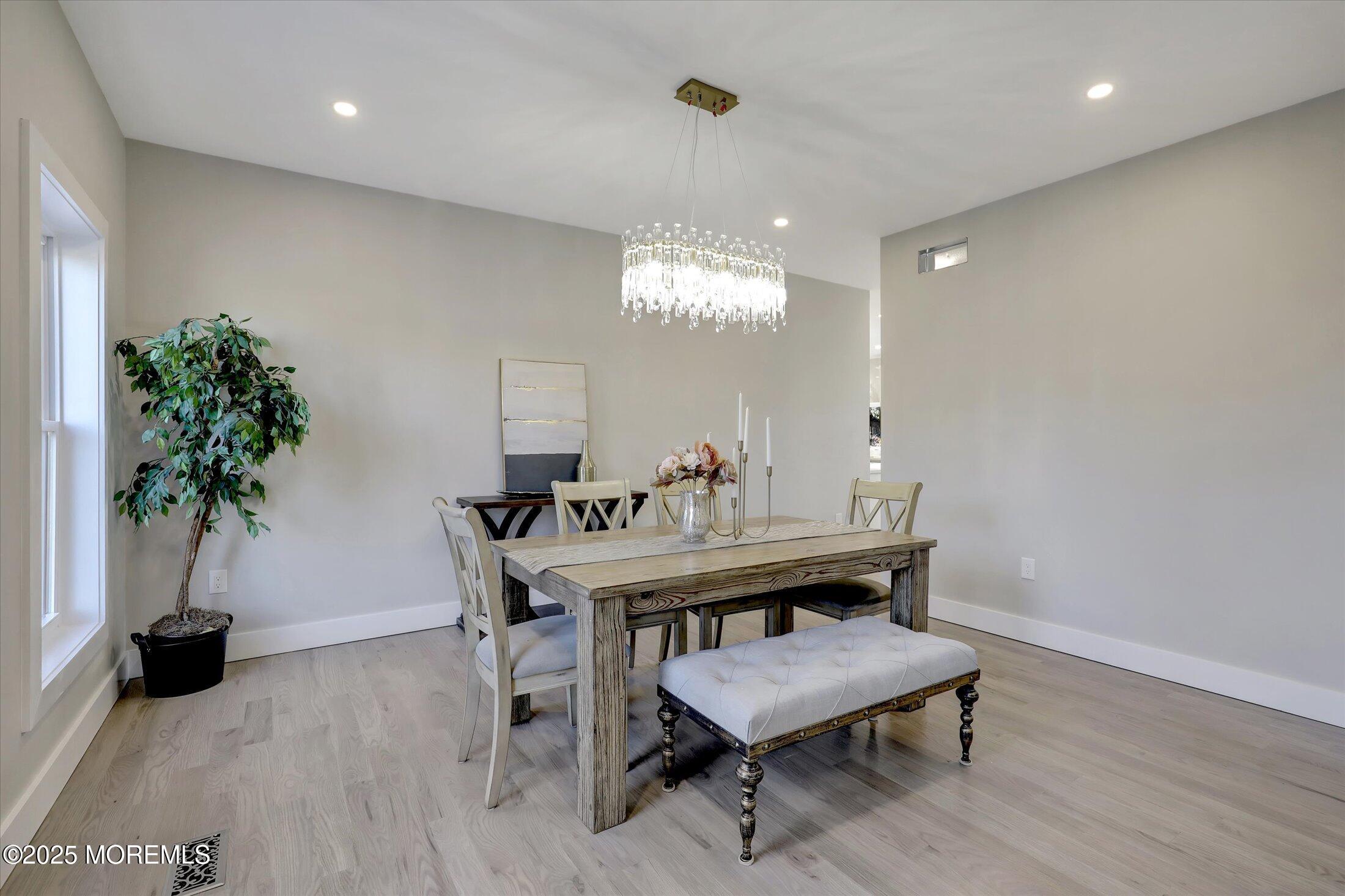 750 Holmdel Road Holmdel, NJ 07733 - Photo 9 of 55 a view of a dining room with furniture and wooden floor