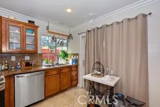 a kitchen with a table chairs and cabinets
