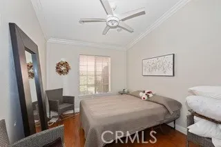 a bed room with a bed and a chandelier