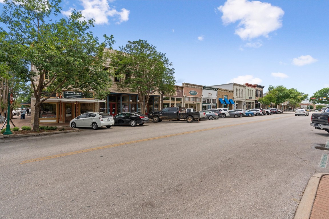 365 County Road 153 Georgetown, TX 78626 - Photo 25 of 35 a city street lined with parked cars and buildings