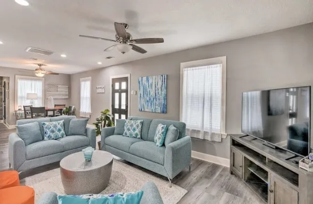 a living room with furniture and a flat screen tv