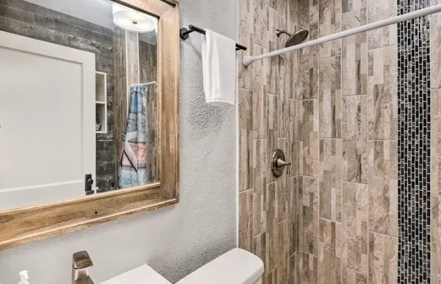 a view of a livingroom with furniture and a window