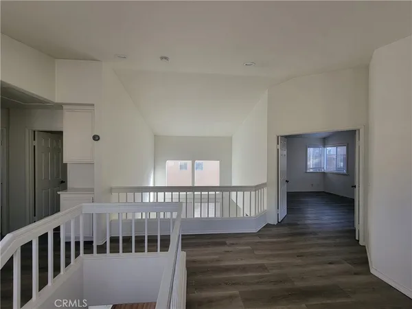 a view of a hallway with a livingroom