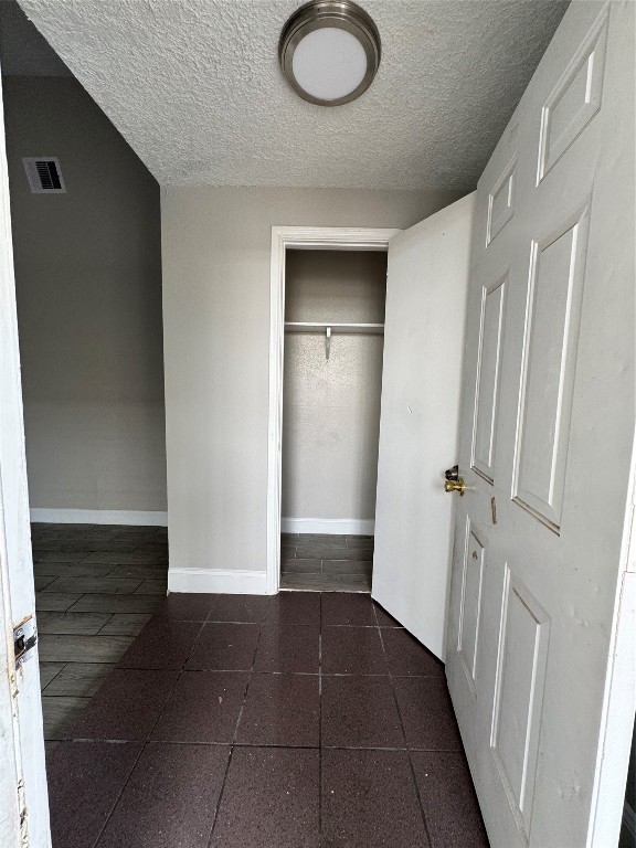 a view of a livingroom with wooden floor and staircase