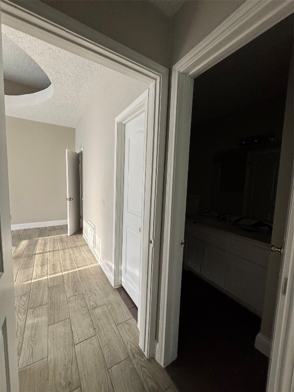 8100 Leonora Street, Unit K3 Houston, TX 77061 - Photo 11 of 15 a view of an empty room with wooden floor and a window