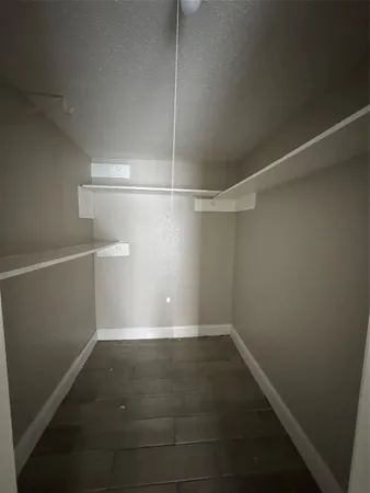 a view of a room with racks on the wall