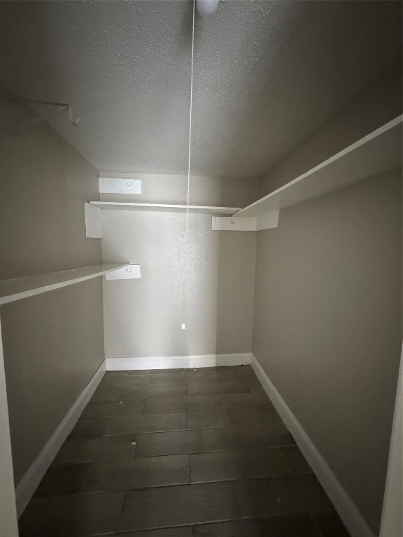 8100 Leonora Street, Unit K3 Houston, TX 77061 - Photo 14 of 15 a view of a room with racks on the wall