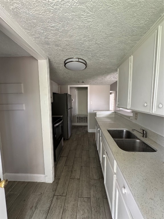 8100 Leonora Street, Unit K3 Houston, TX 77061 - Photo 6 of 15 a kitchen with granite countertop a sink and cabinets