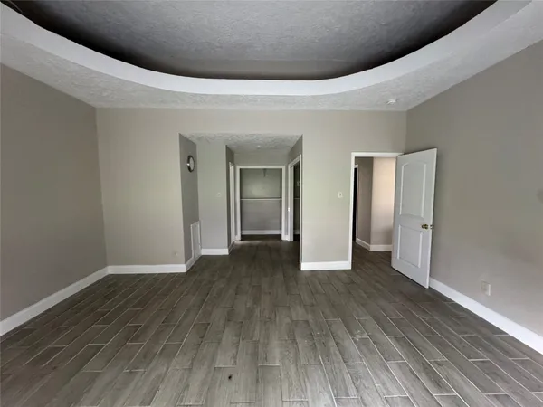 a view of a livingroom with wooden floor