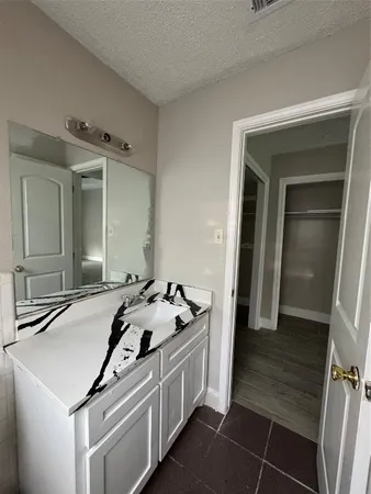 a kitchen that has a sink and a stove in it