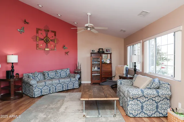 a living room with furniture and a large window