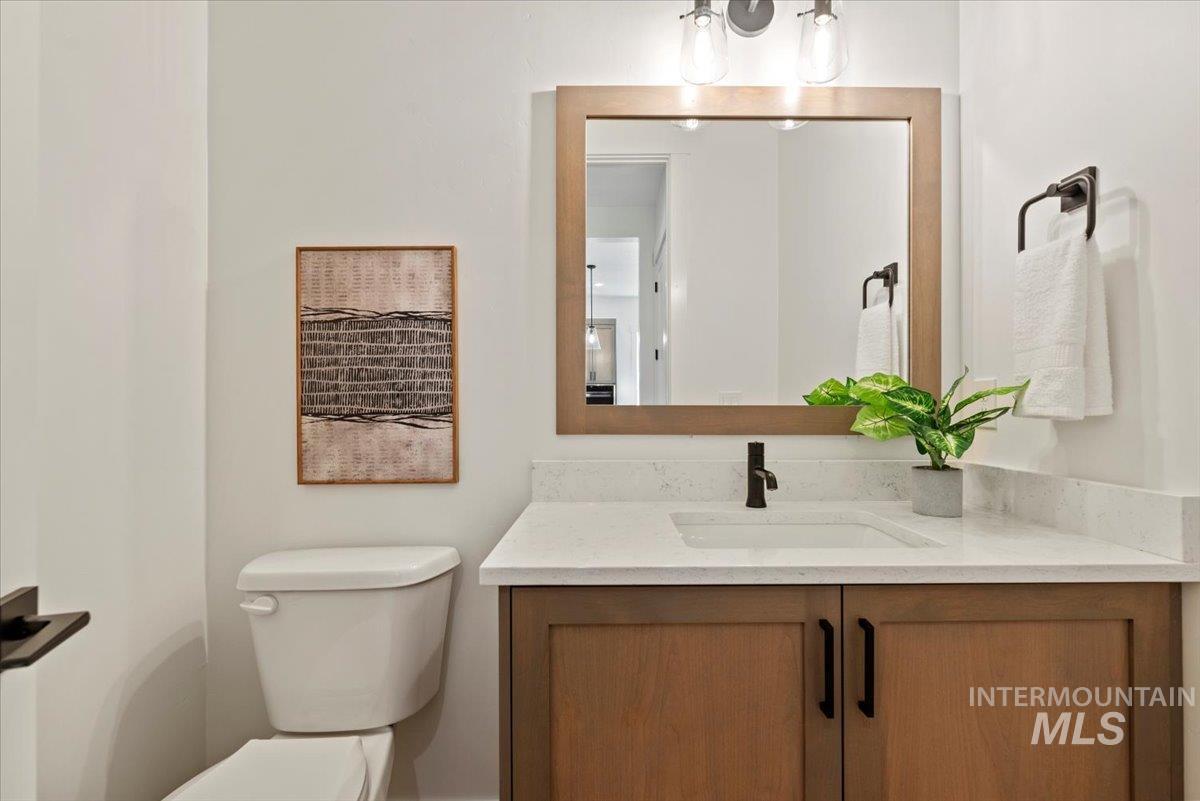 677 North Morning Glory Way Eagle, ID 83616 - Photo 18 of 29 Half bath featuring toilet and vanity