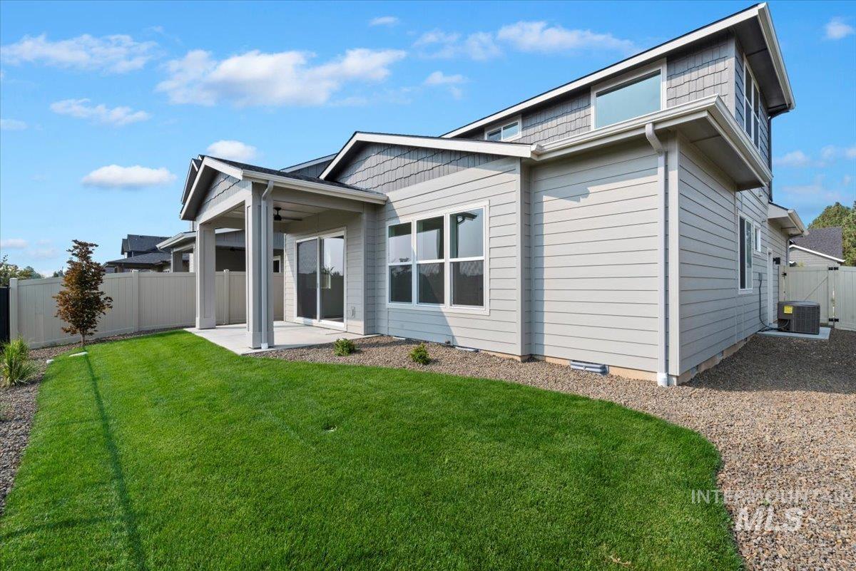 677 North Morning Glory Way Eagle, ID 83616 - Photo 27 of 29 Back of house with a fenced backyard, a patio, and ceiling fan