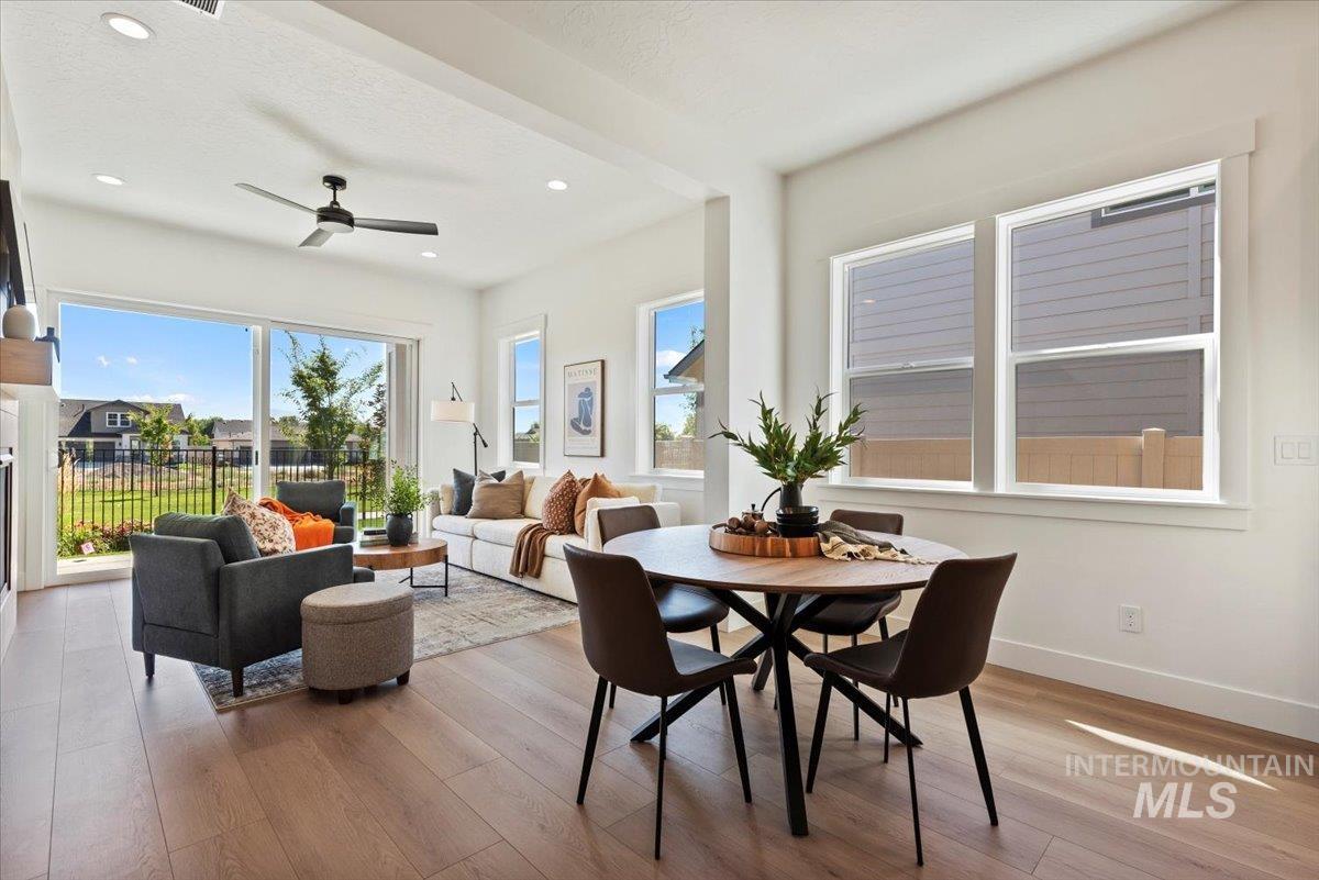 677 North Morning Glory Way Eagle, ID 83616 - Photo 7 of 29 Dining room featuring light wood-style floors, recessed lighting, and ceiling fan