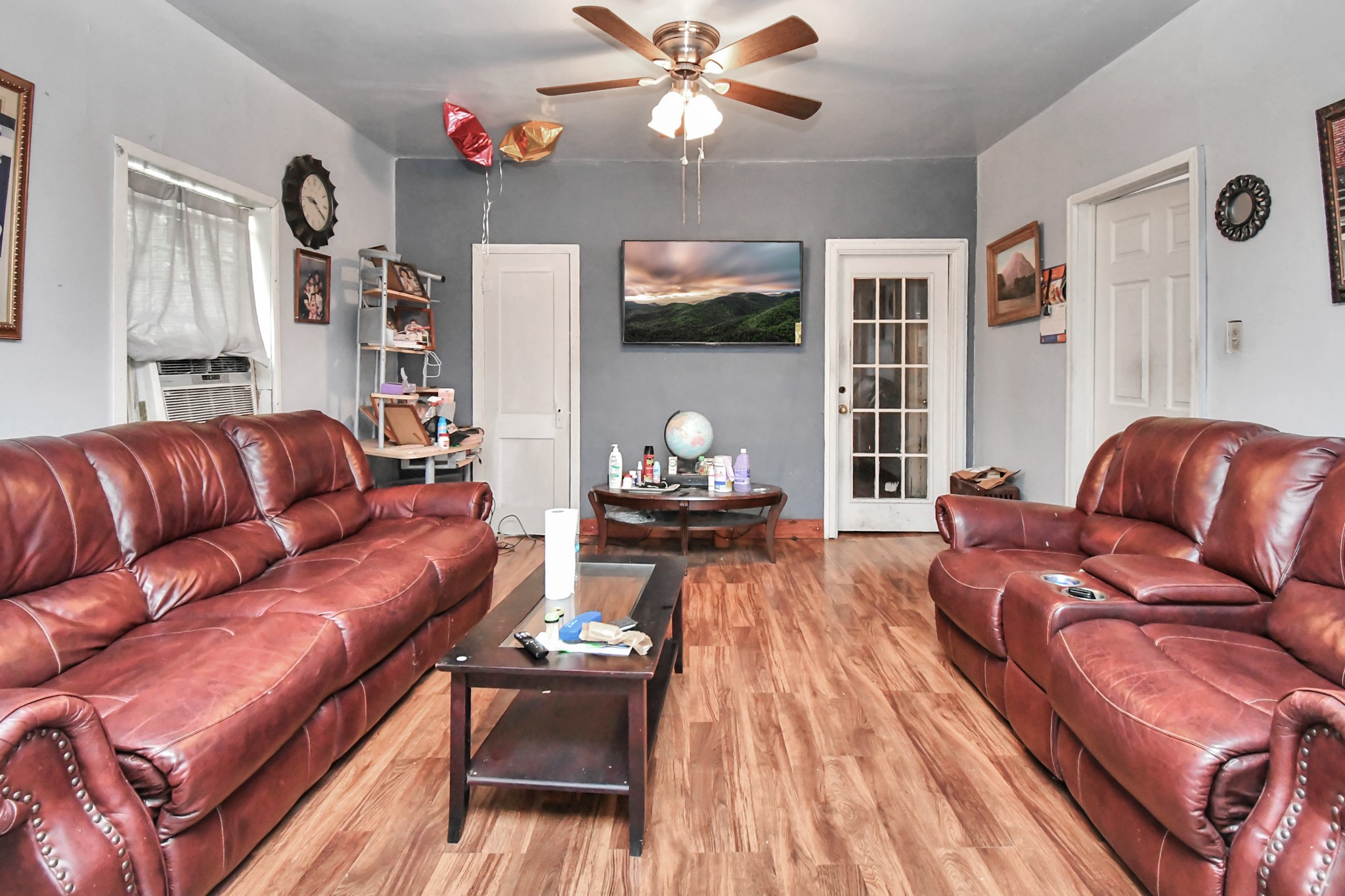 7908 John Street Houston, TX 77012 - Photo 12 of 30 a living room with furniture ceiling fan and a rug